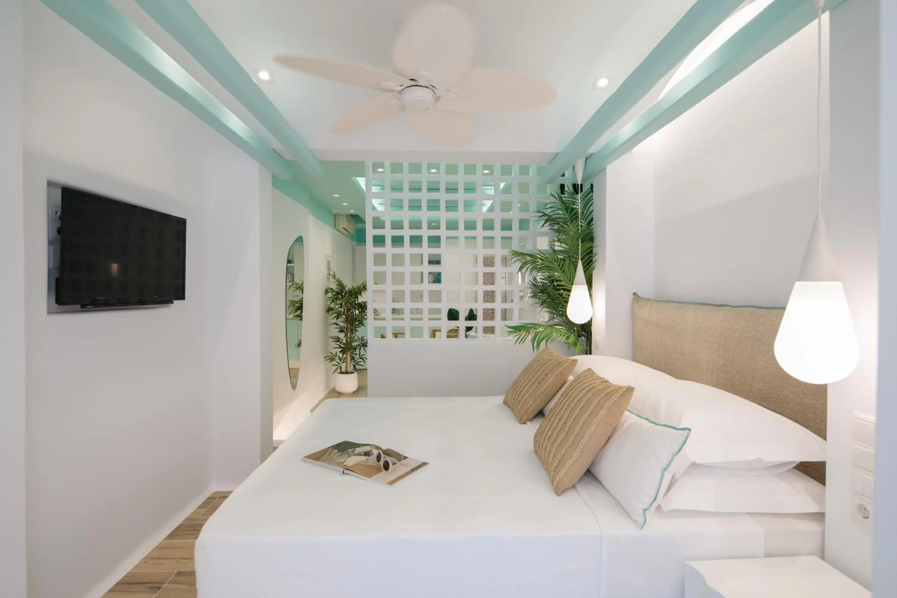 Bed in Flora Apartments & Studios
