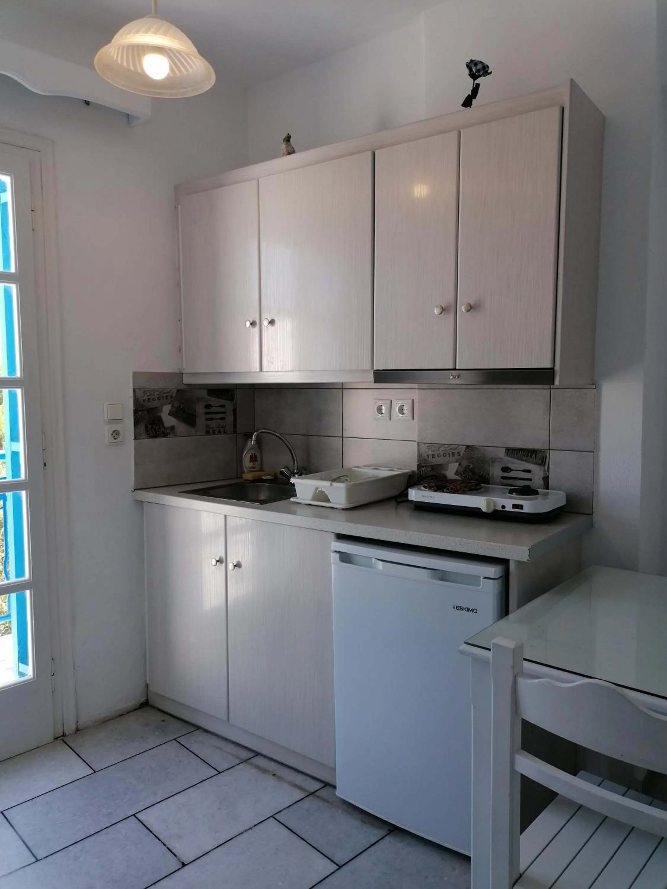 Kitchen or kitchenette in Flora Apartments & Studios