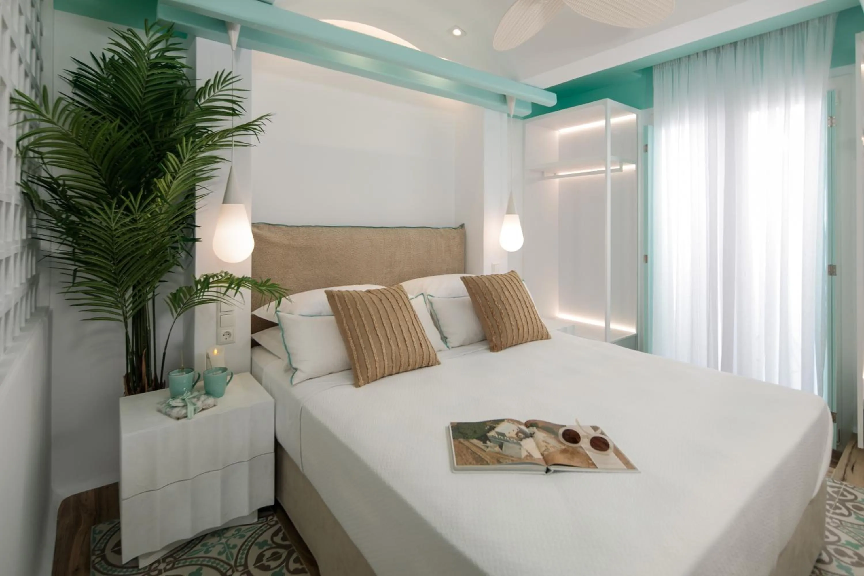 Bed in Flora Apartments & Studios