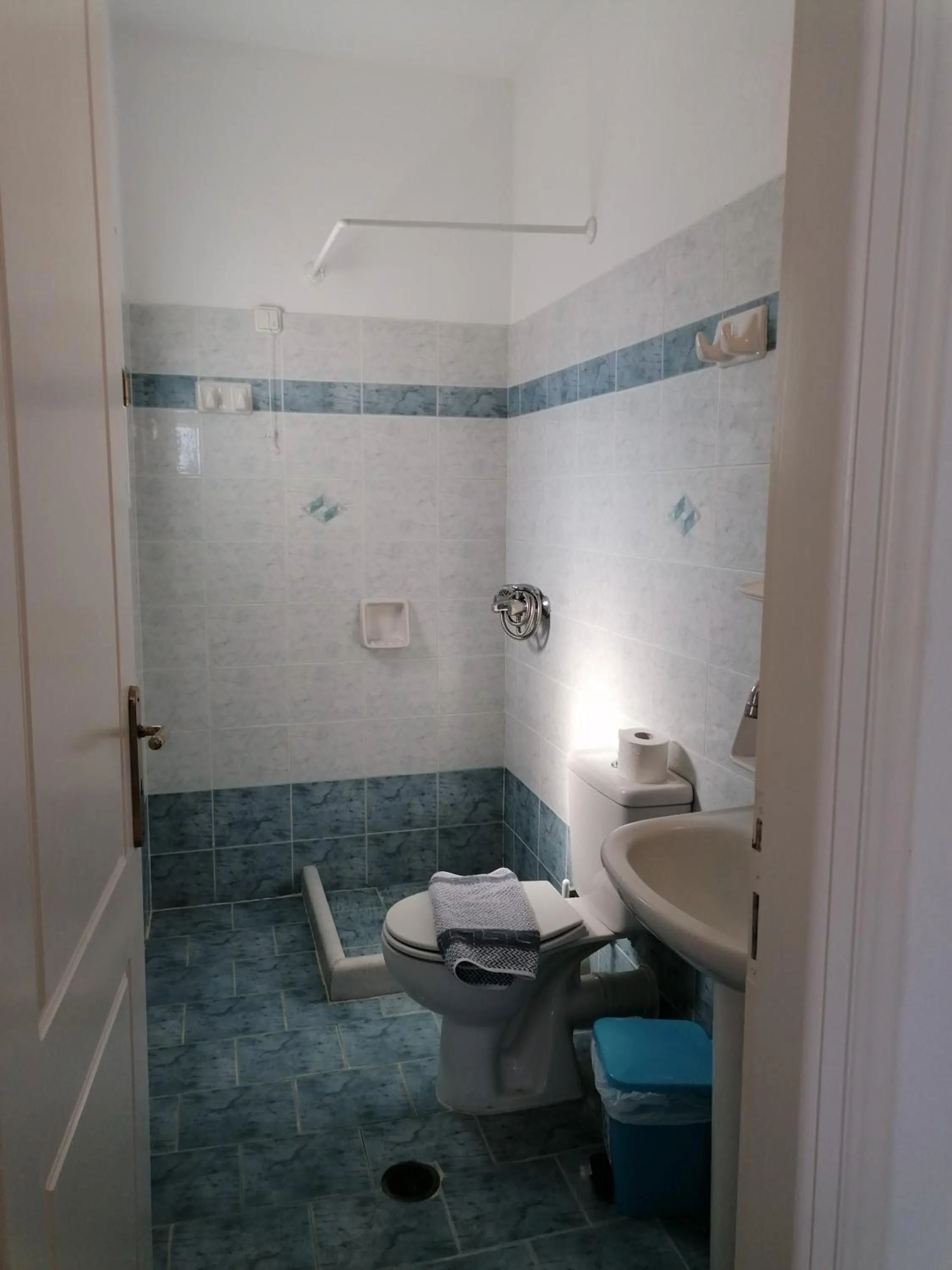 Bathroom in Flora Apartments & Studios