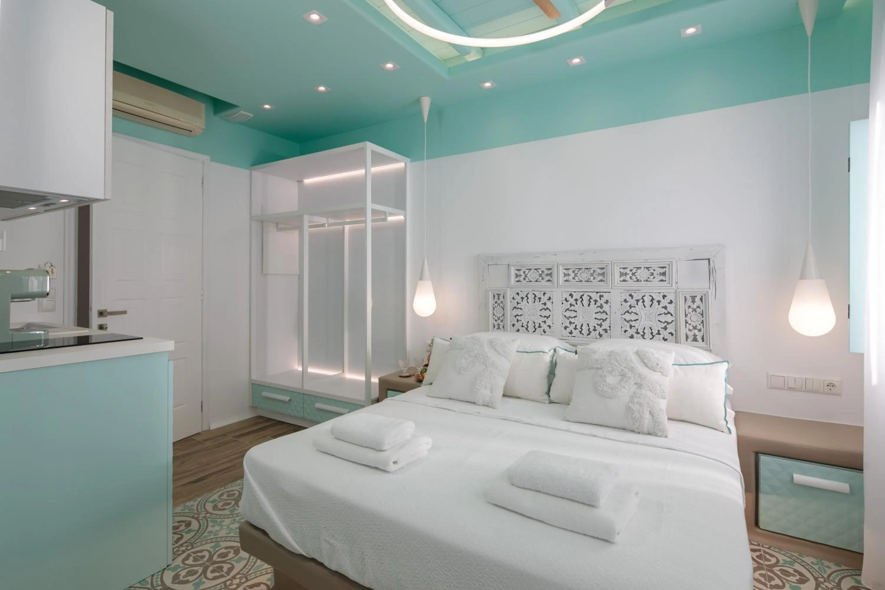 Bed in Flora Apartments & Studios
