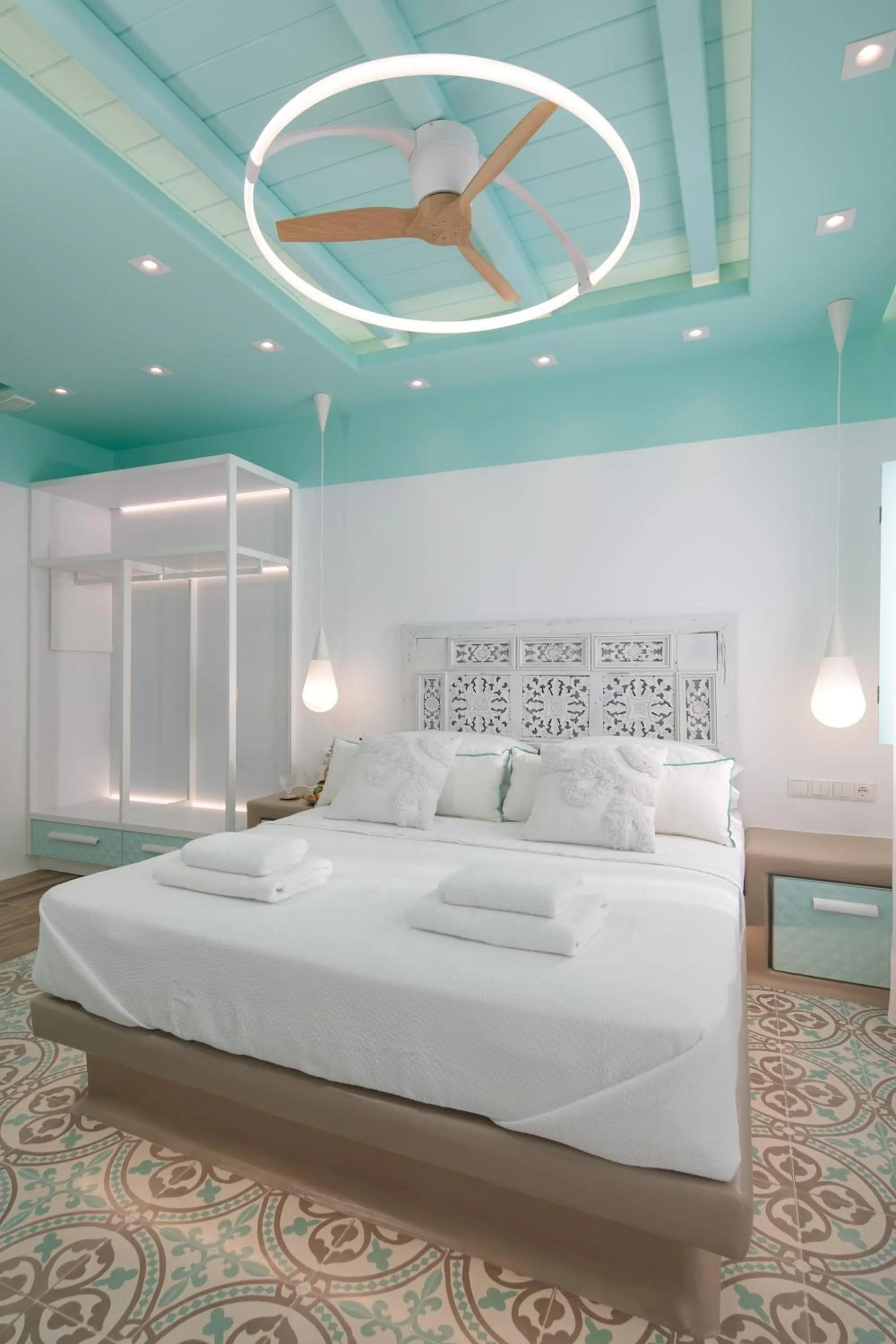 Bed in Flora Apartments & Studios