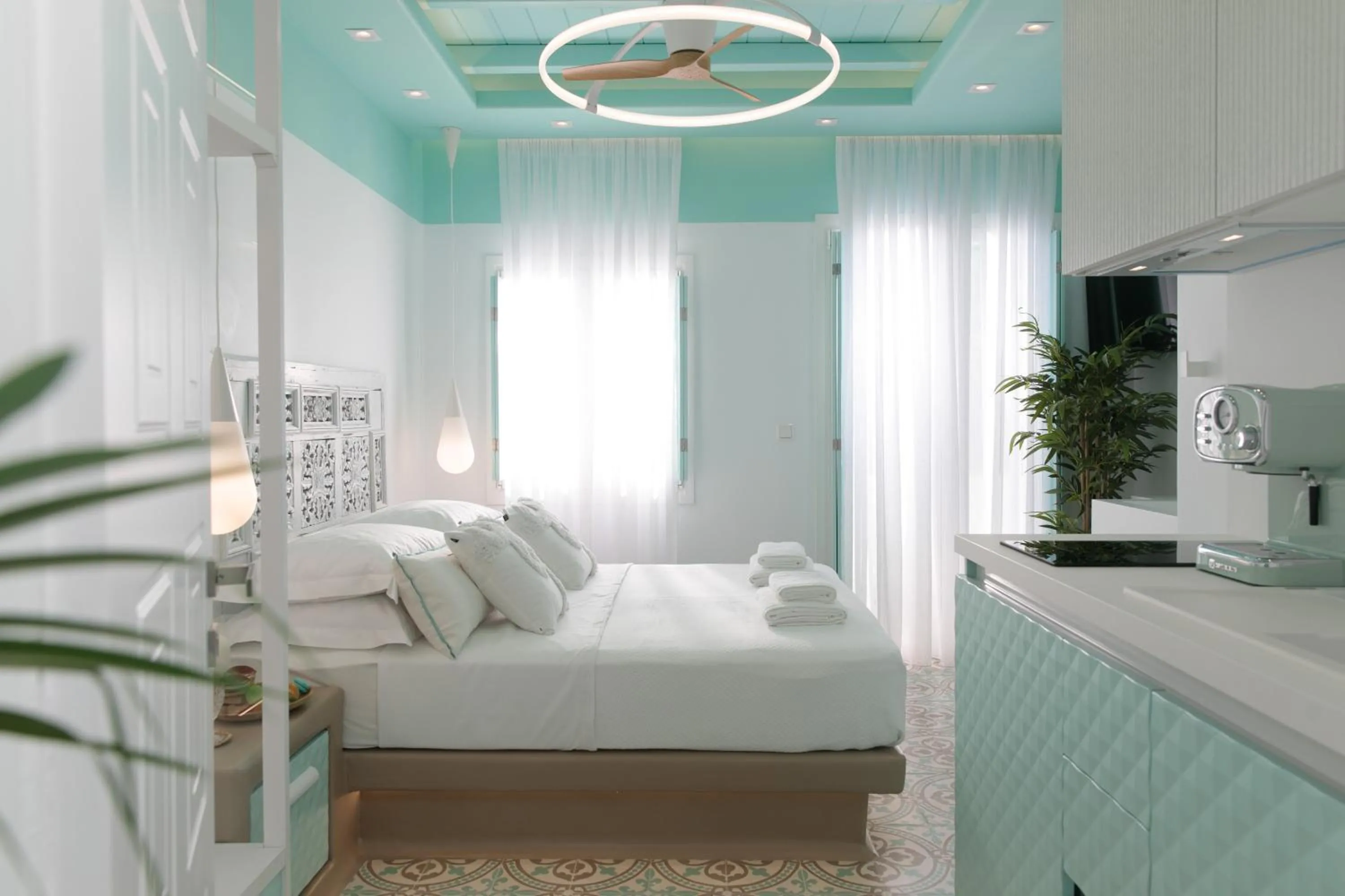 Bed in Flora Apartments & Studios
