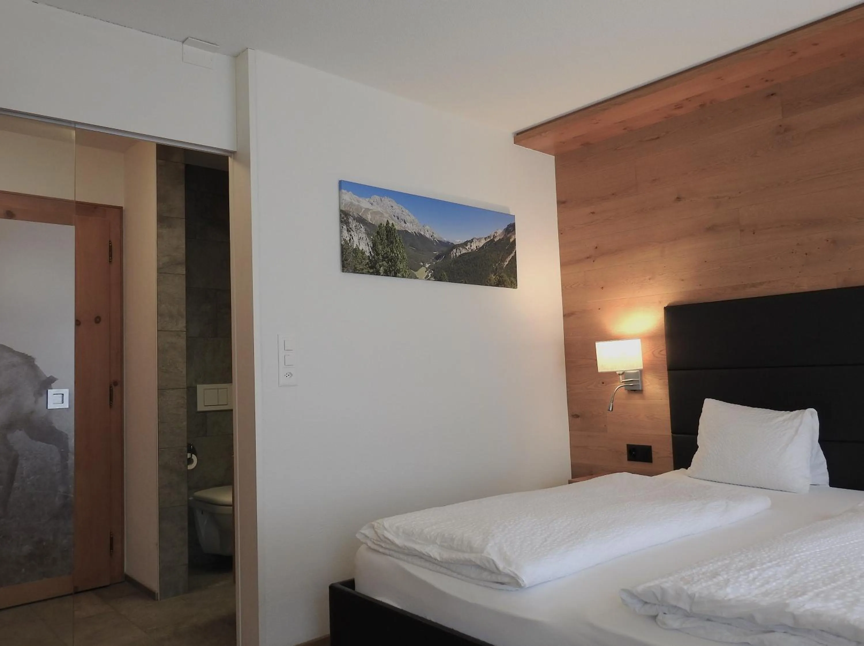 Photo of the whole room, Bed in Hotel Spöl Restaurant