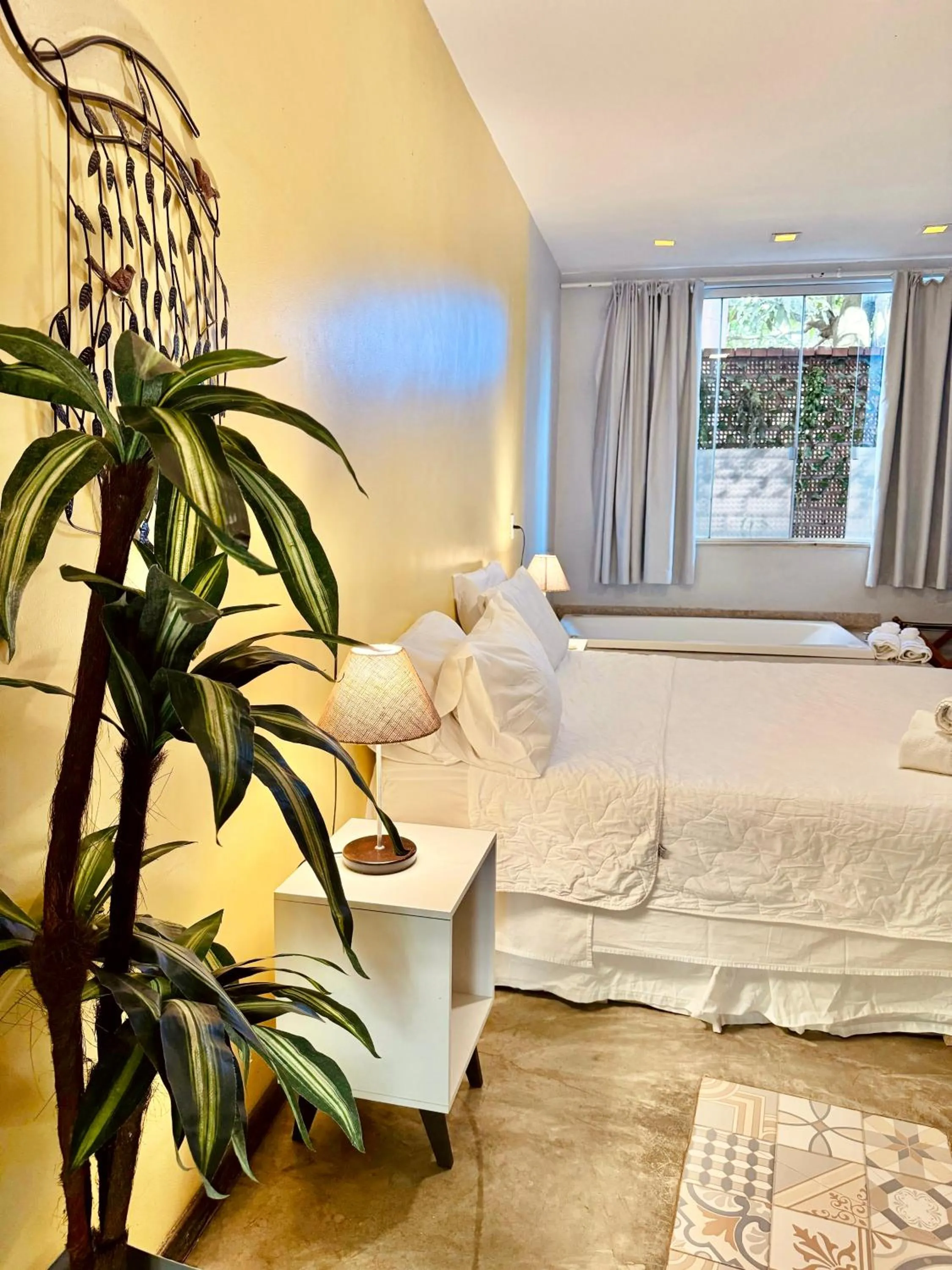 Bed in Pousada Casa das Flores