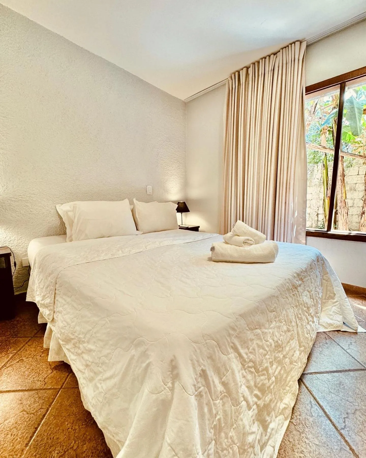 Bed in Pousada Casa das Flores