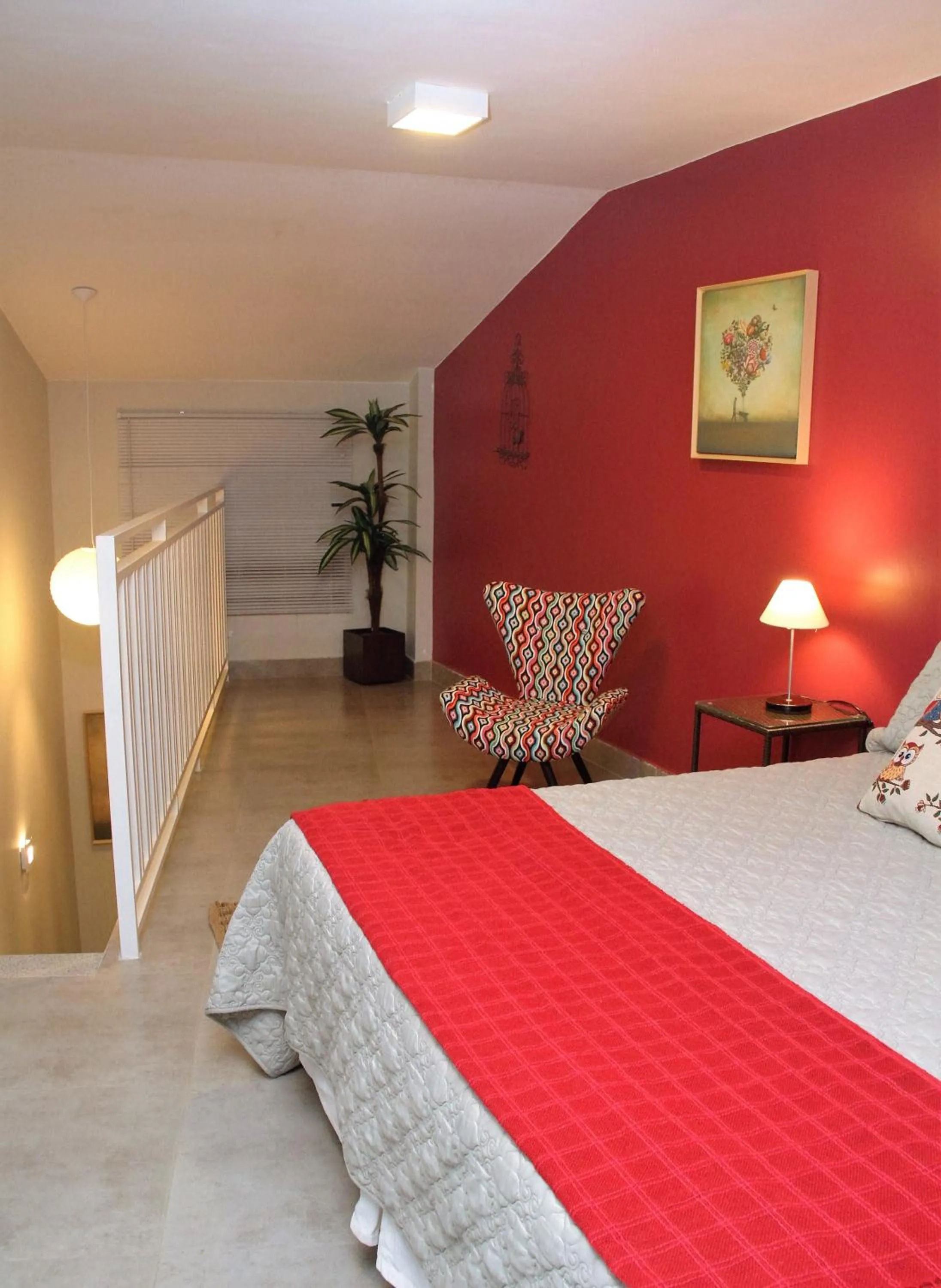 Living room, Bed in Pousada Casa das Flores