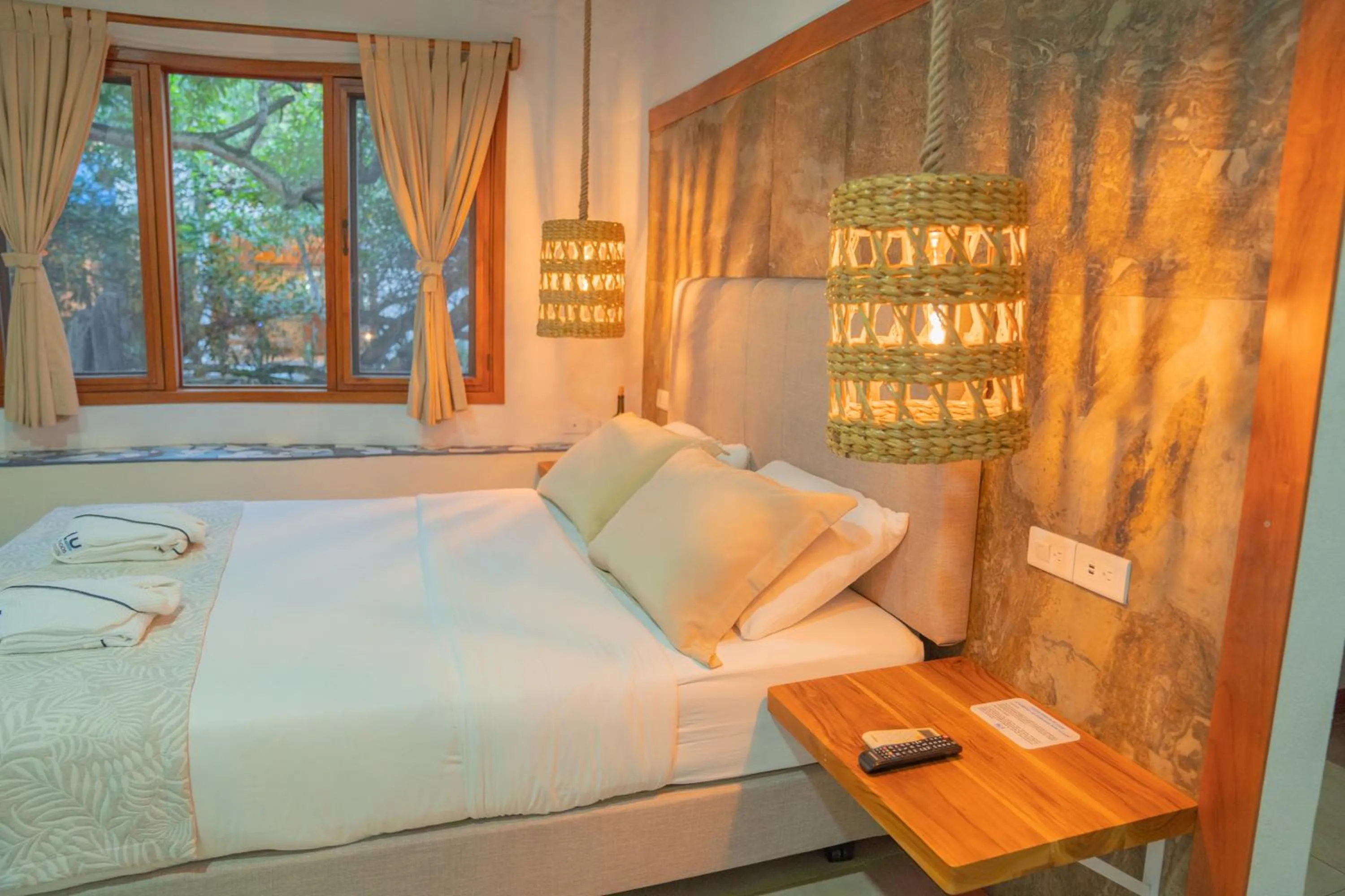 Bed in Blu Galapagos Sustainable Waterfront Lodge