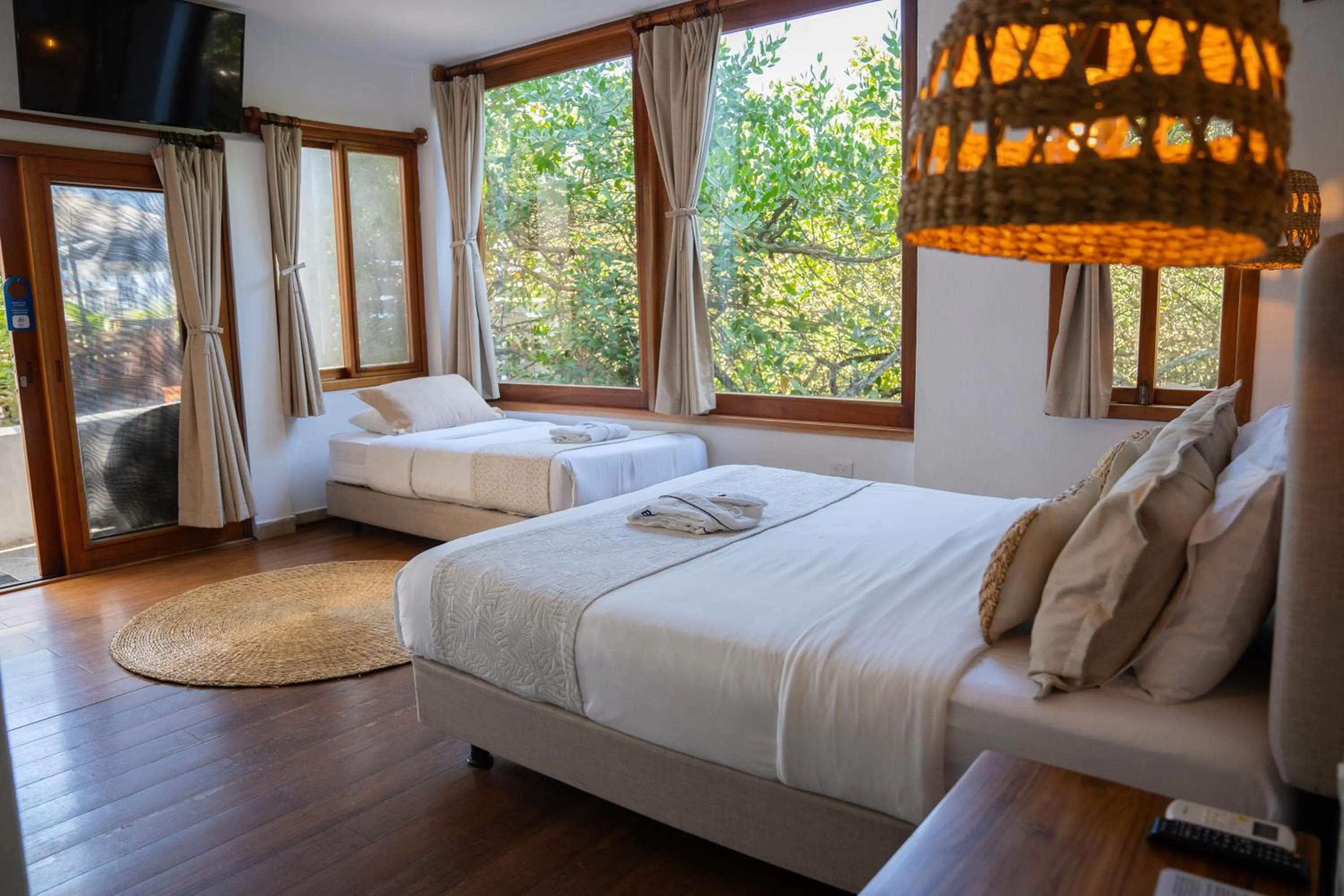 Bed in Blu Galapagos Sustainable Waterfront Lodge