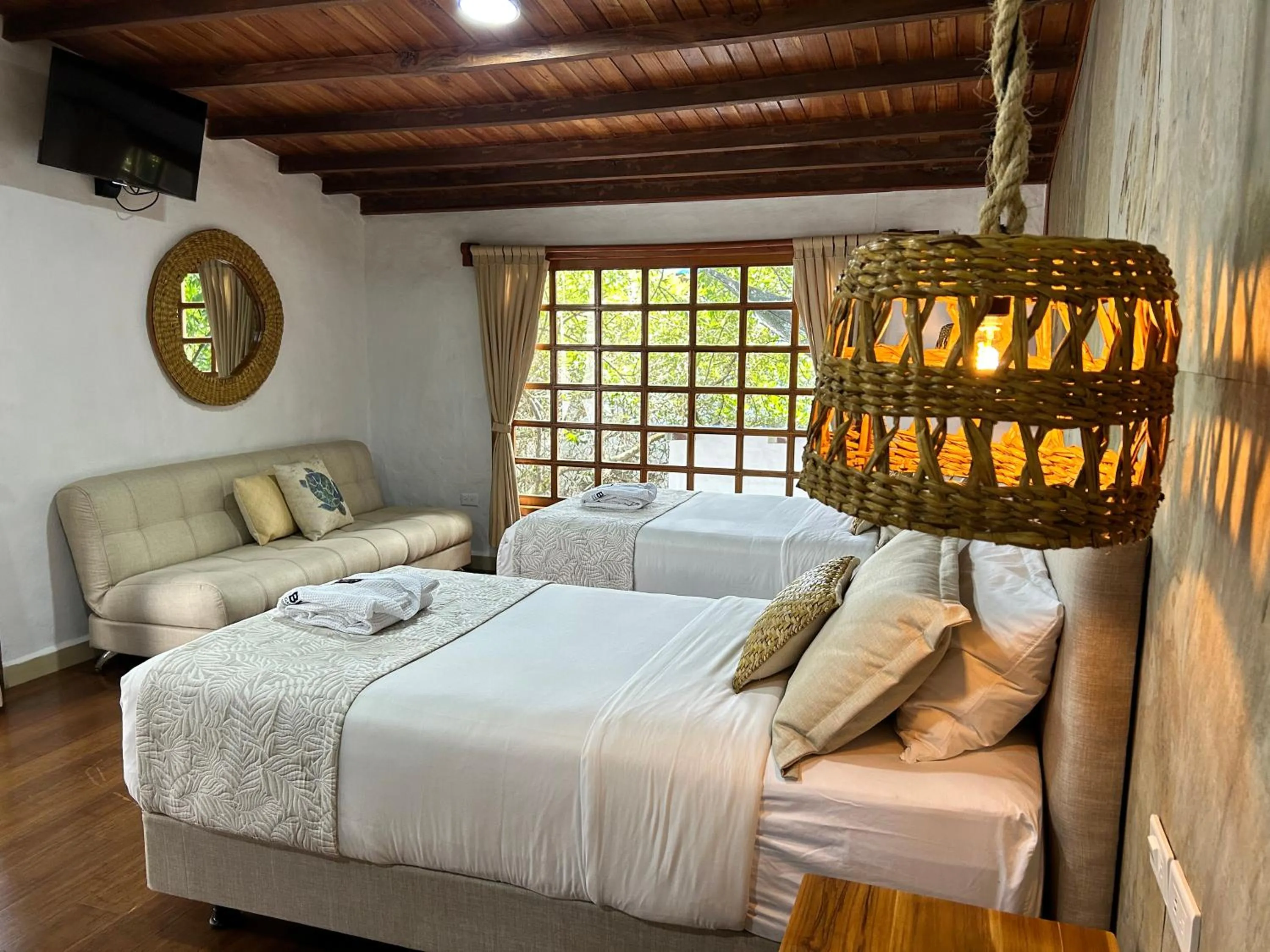 Bed in Blu Galapagos Sustainable Waterfront Lodge