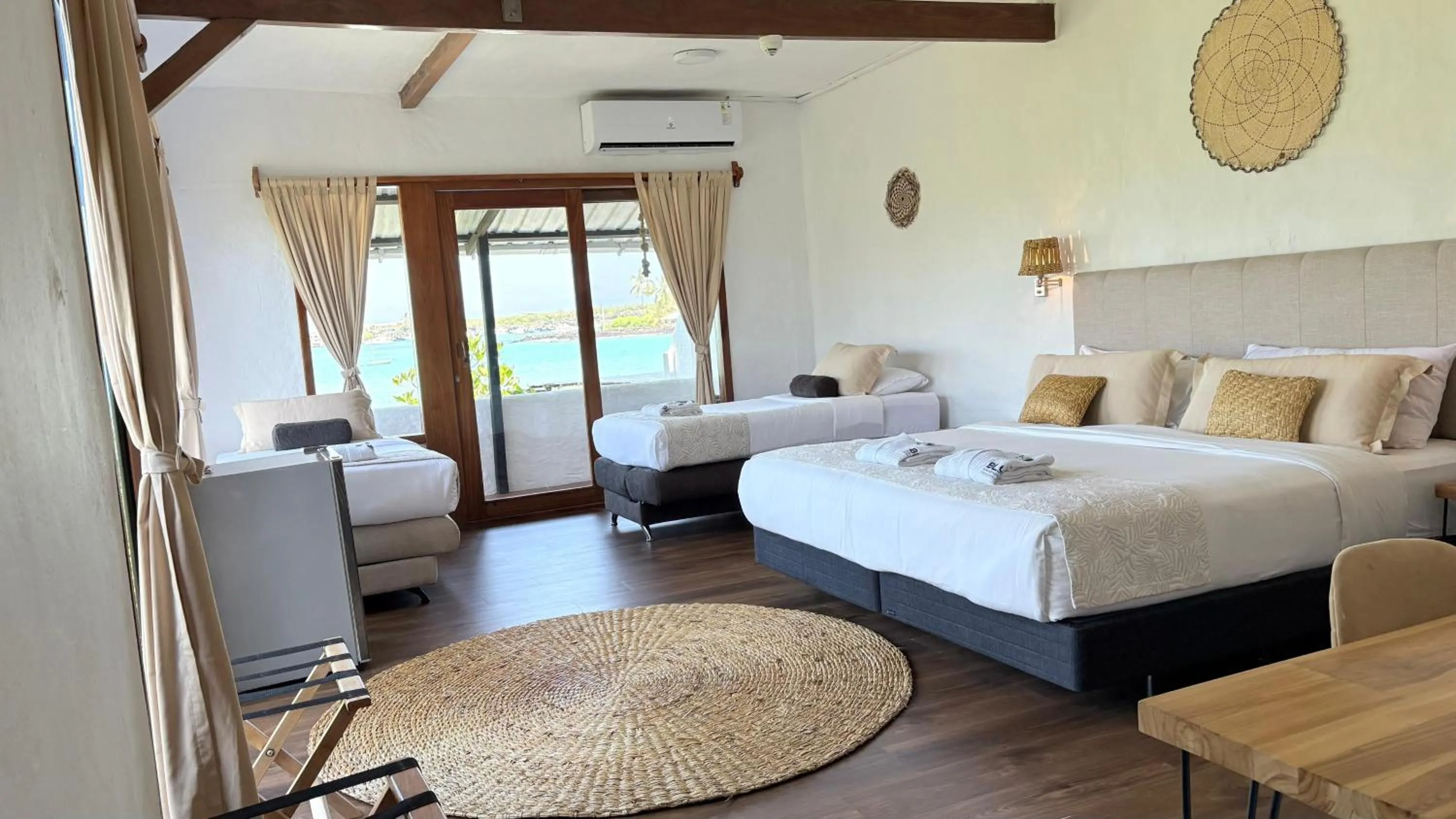 Photo of the whole room, Bed in Blu Galapagos Sustainable Waterfront Lodge