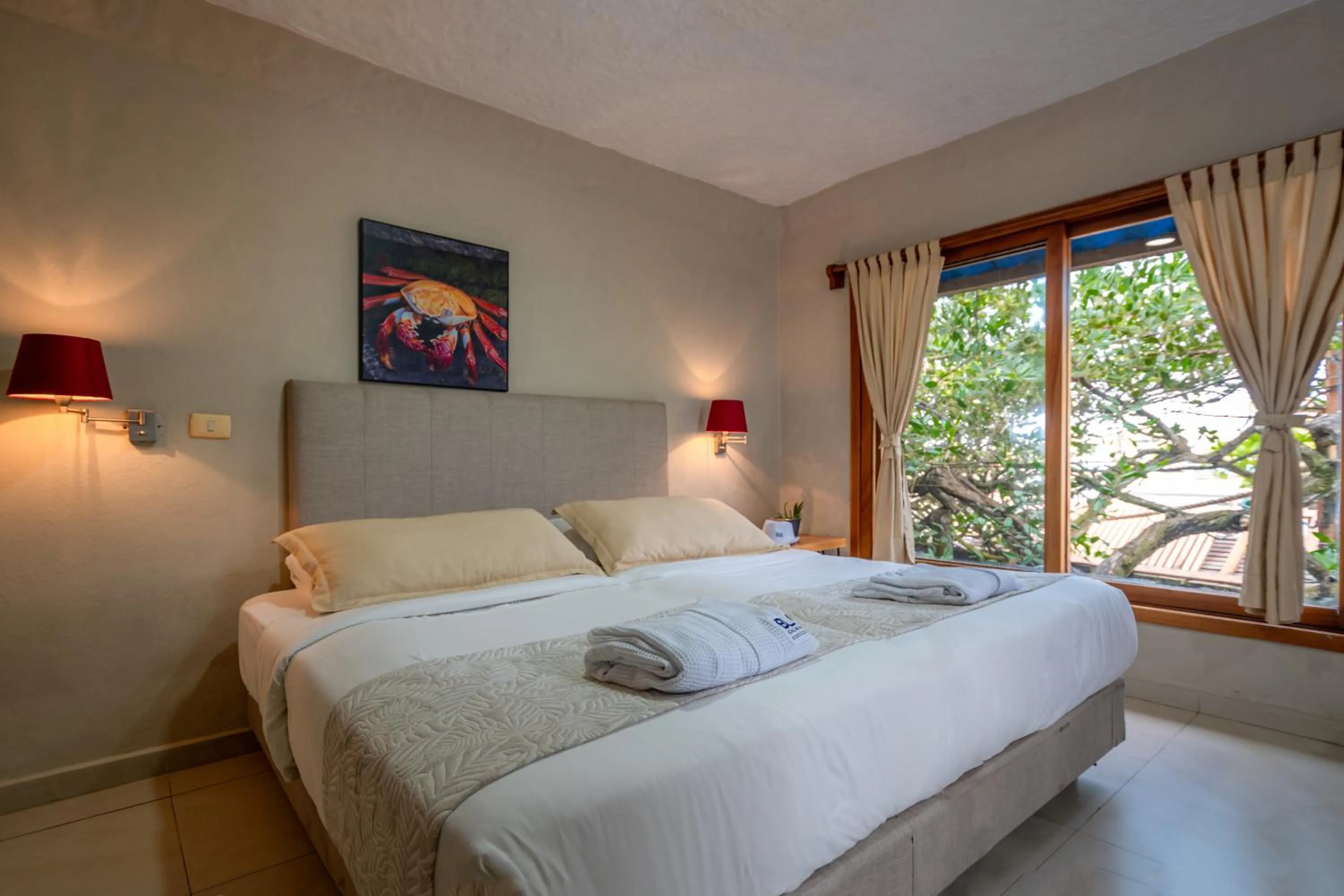 Bed in Blu Galapagos Sustainable Waterfront Lodge