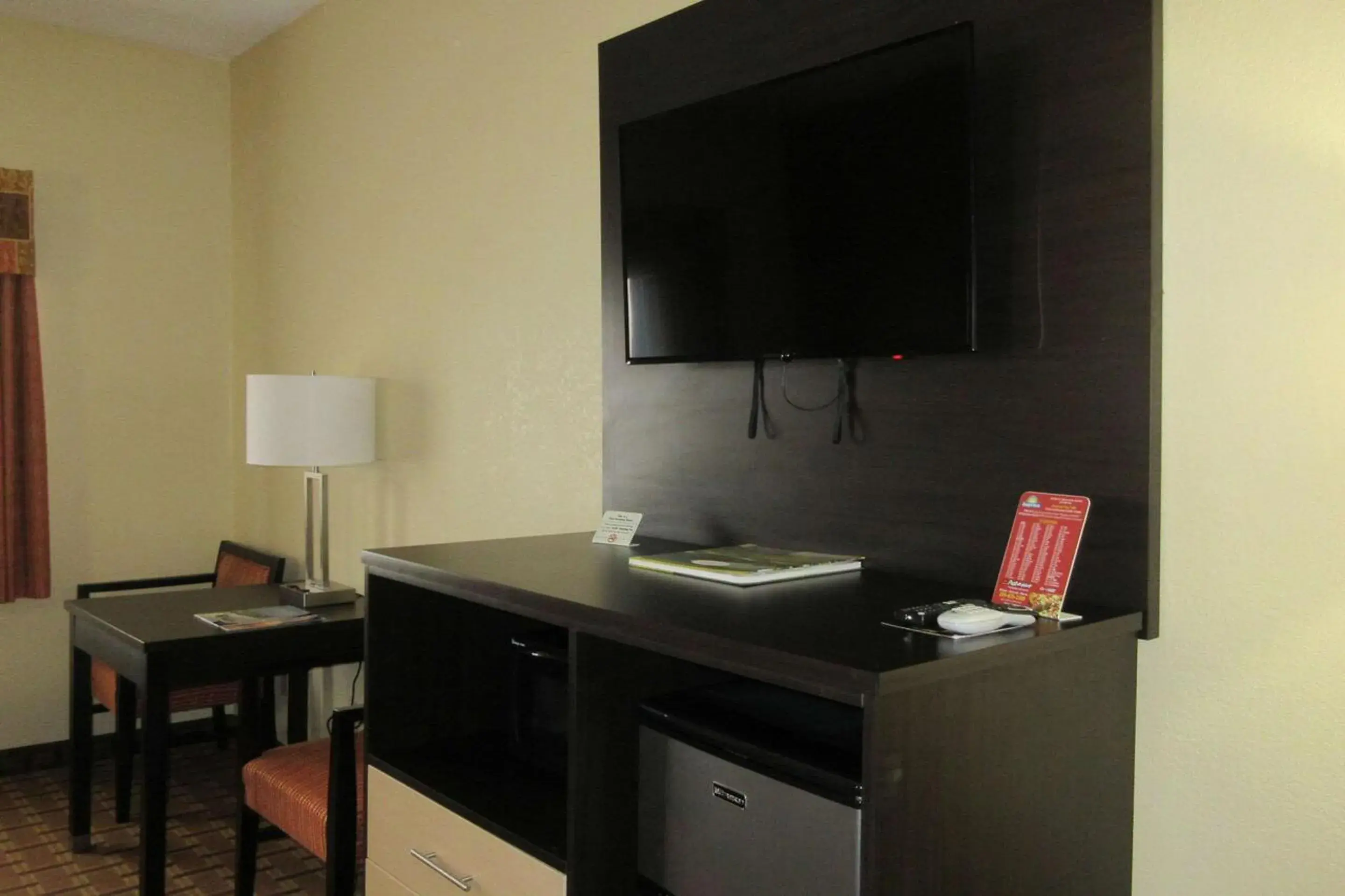 Photo of the whole room, TV/Entertainment Center in Quality Inn & Suites