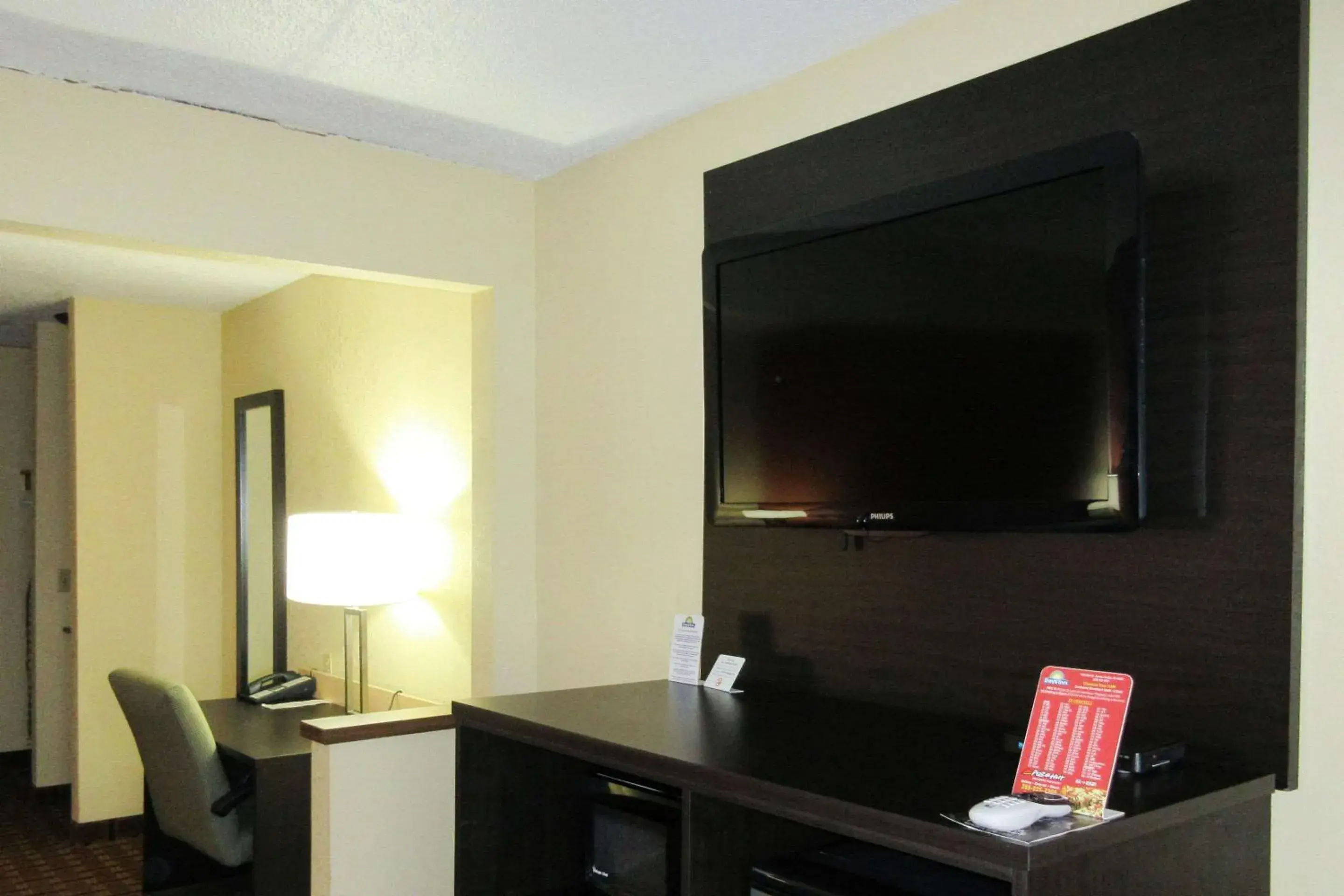 Photo of the whole room, TV/Entertainment Center in Quality Inn & Suites