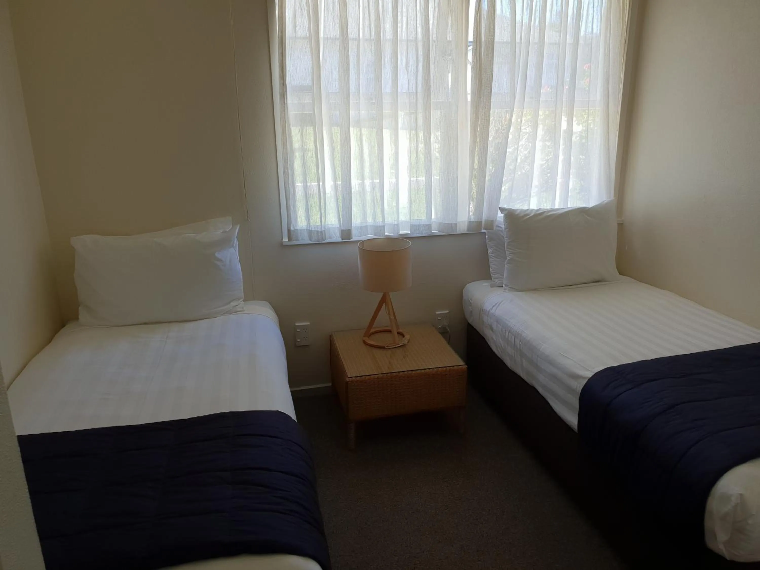 Bedroom, Bed in Hananui Lodge and Apartments