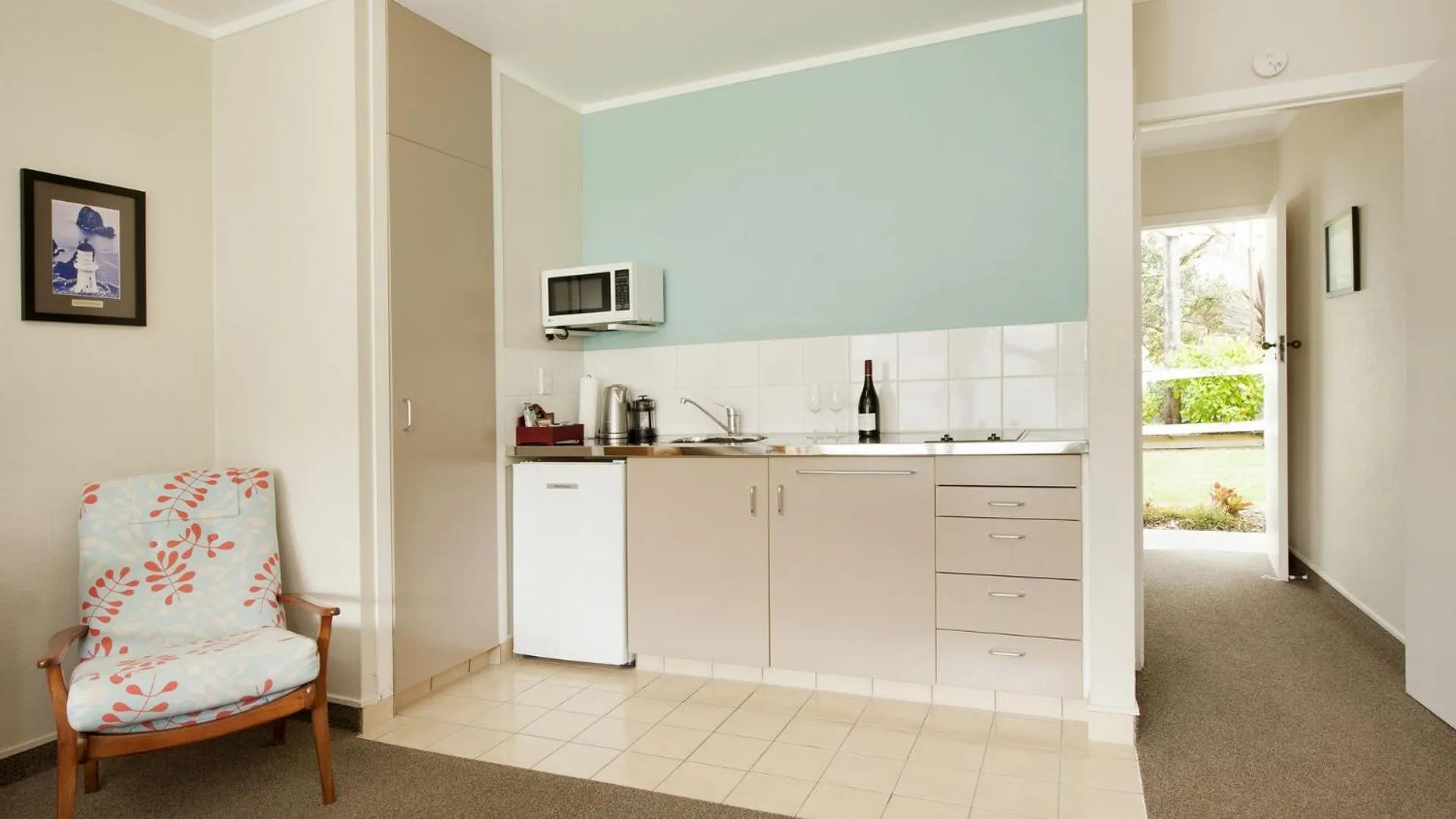 Kitchen or kitchenette in Hananui Lodge and Apartments