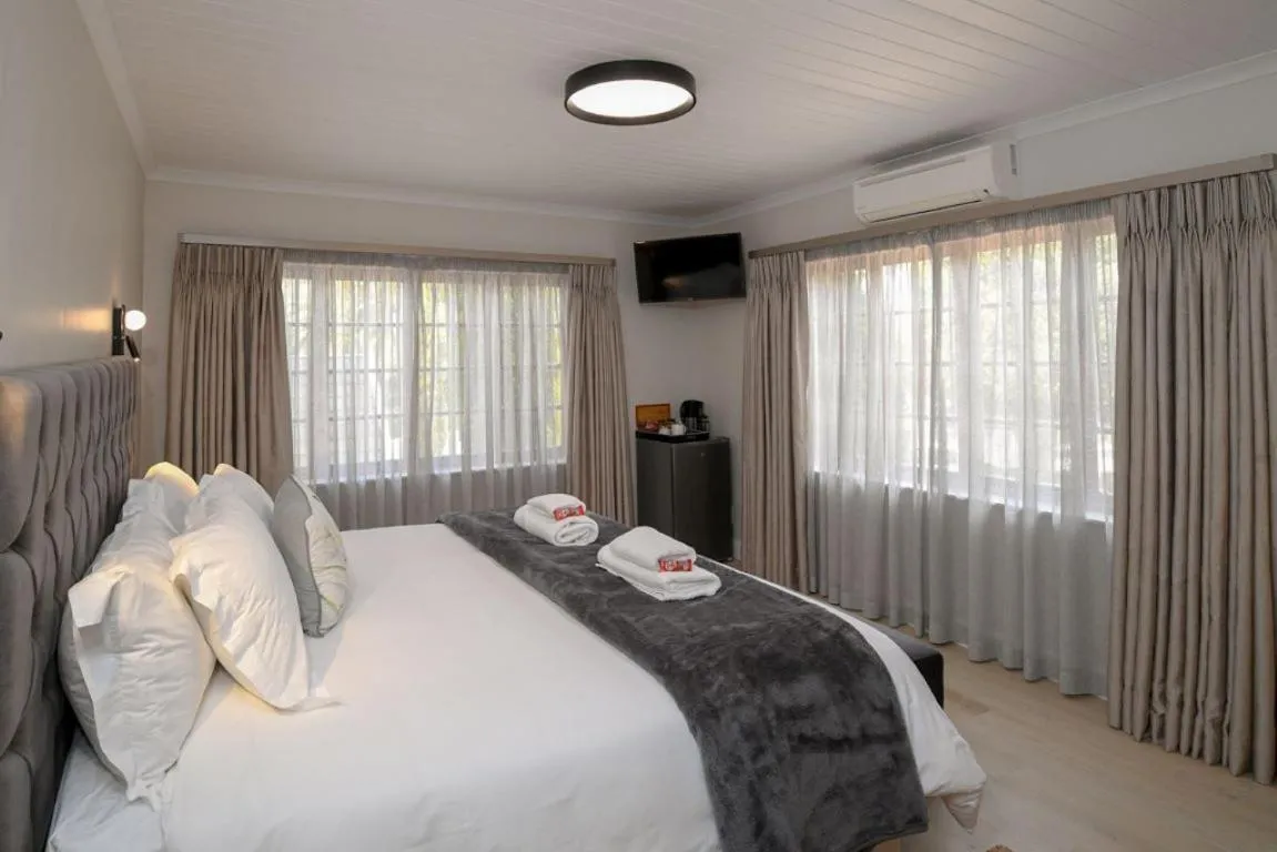 Bed in Dark Chocolate Guest House