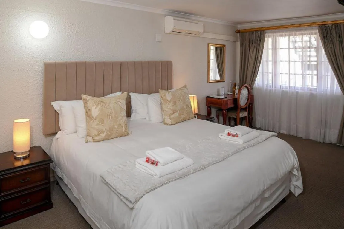 Bed in Dark Chocolate Guest House