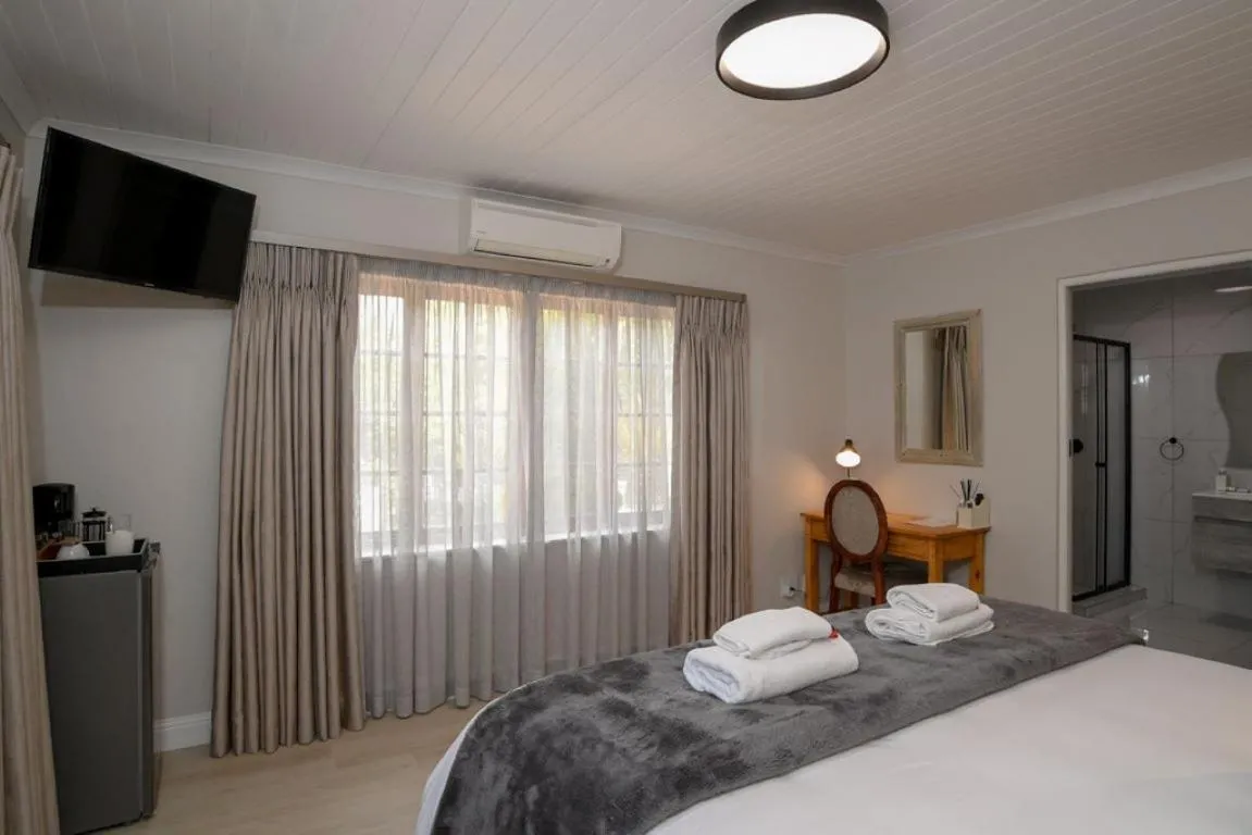 Bed in Dark Chocolate Guest House