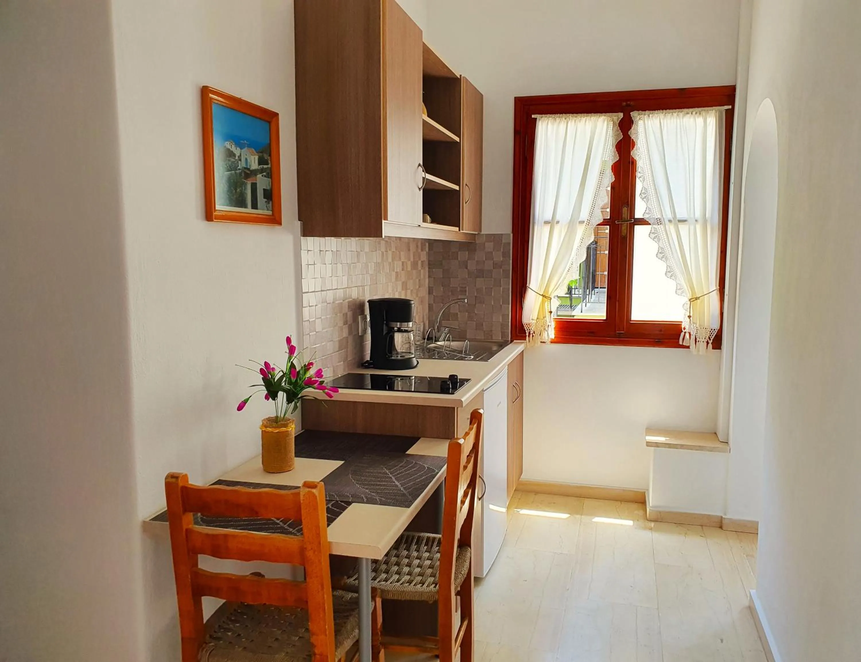 Kitchen or kitchenette in Nina Apartments