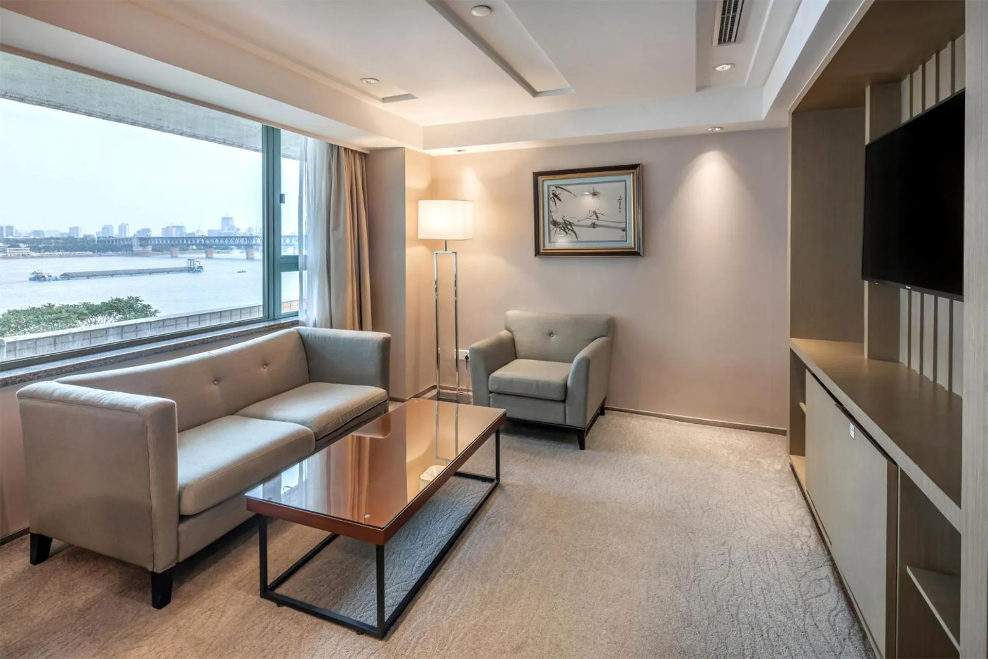 Living room in Holiday Inn Wuhan Riverside by IHG