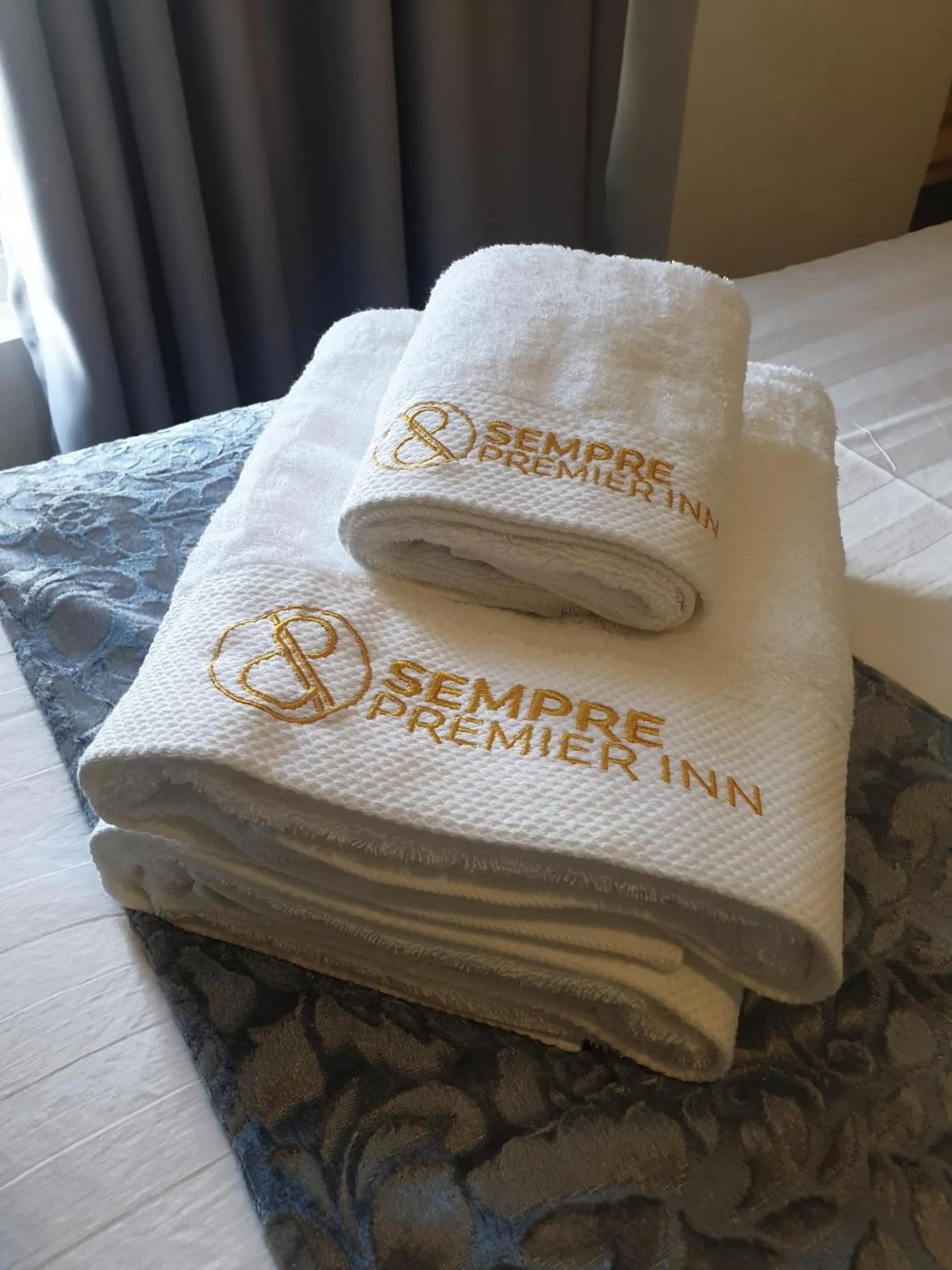 towels in Sempre Premier Inn - MACTAN AIRPORT HOTEL