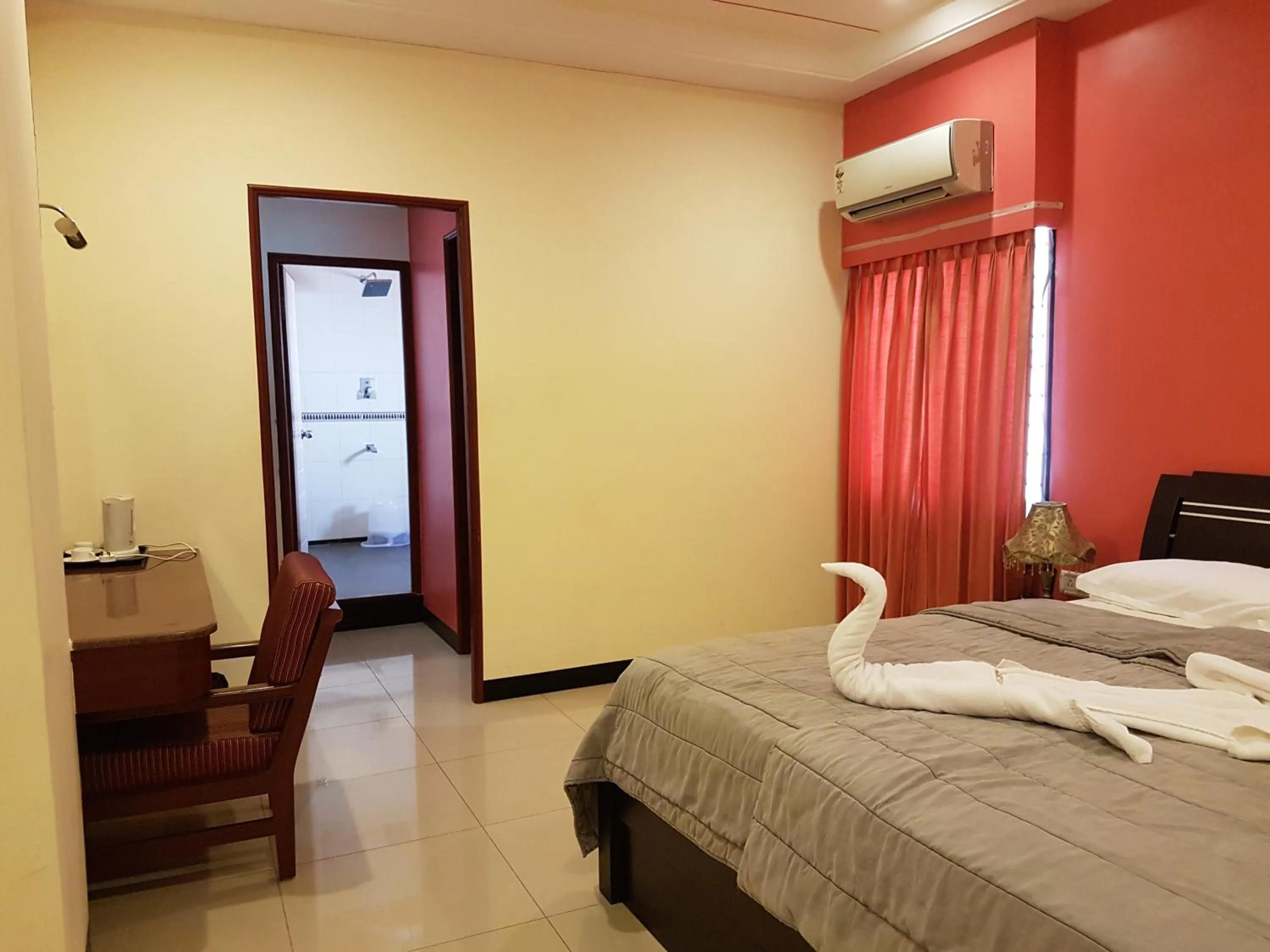 Bed in Hotel Subhalakshmi Palace