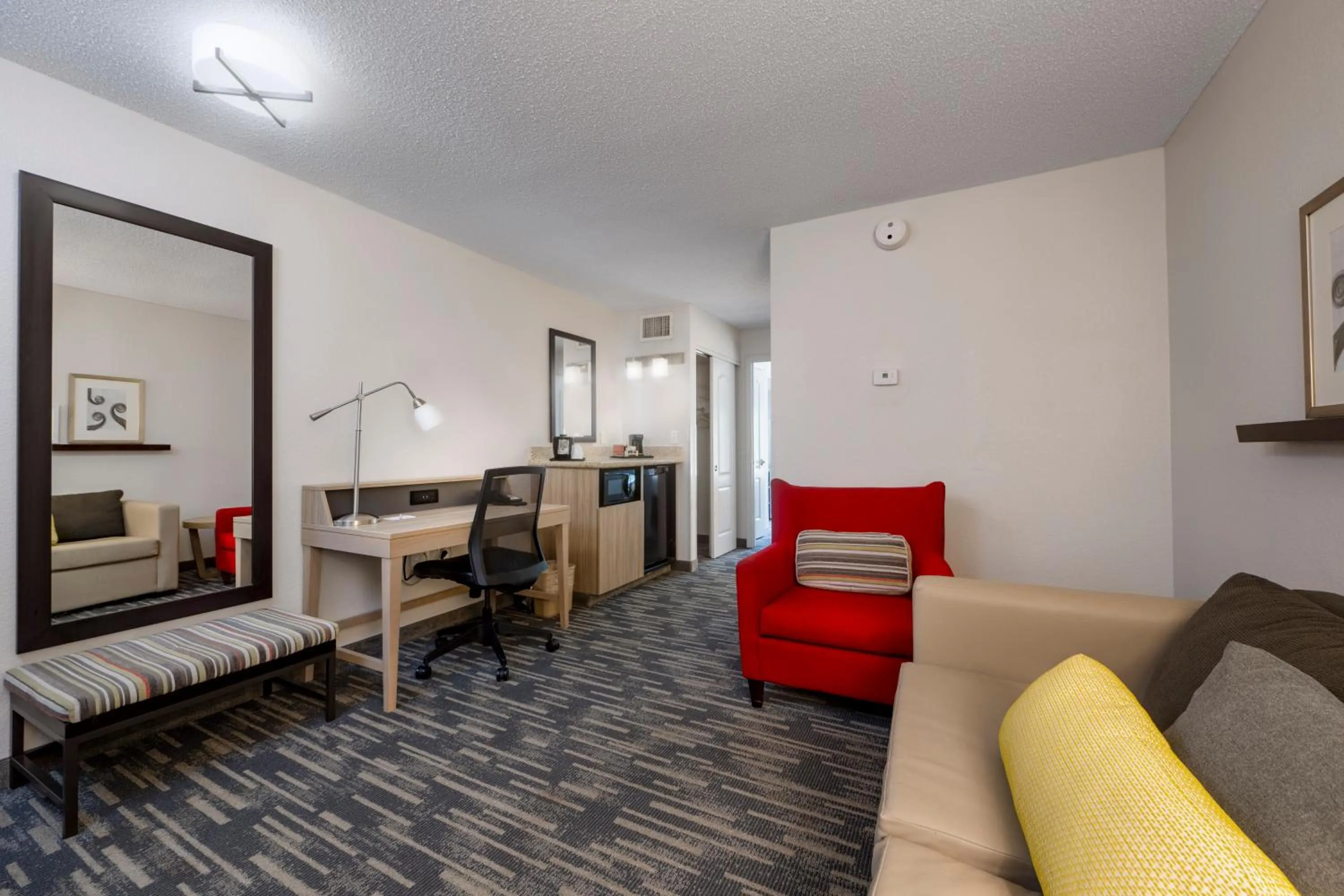 Living room in Country Inn & Suites by Radisson, Queensbury - Lake George , NY