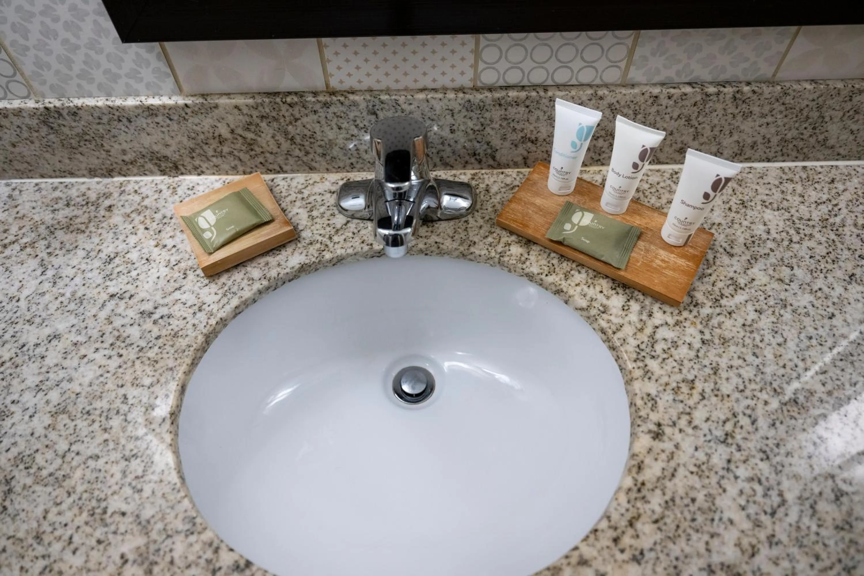 Bathroom in Country Inn & Suites by Radisson, Queensbury - Lake George , NY