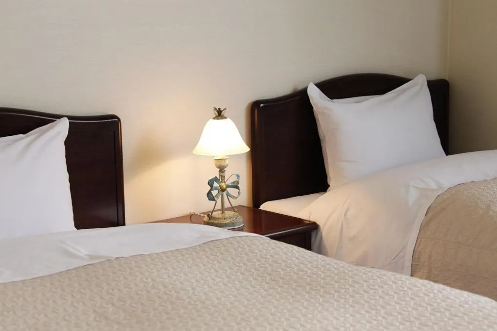 Bed in HOTEL 24sweets HAKUBA