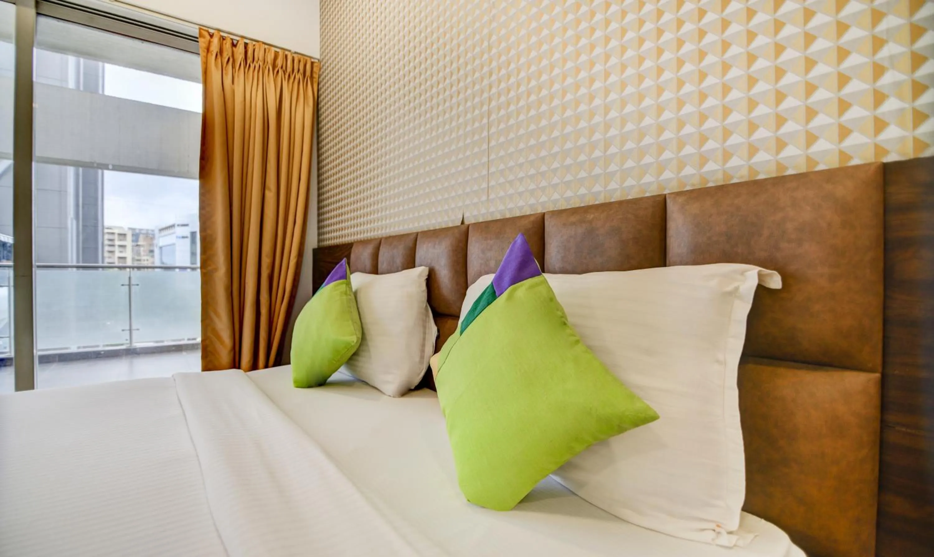 Bed in Treebo Kuval Inn