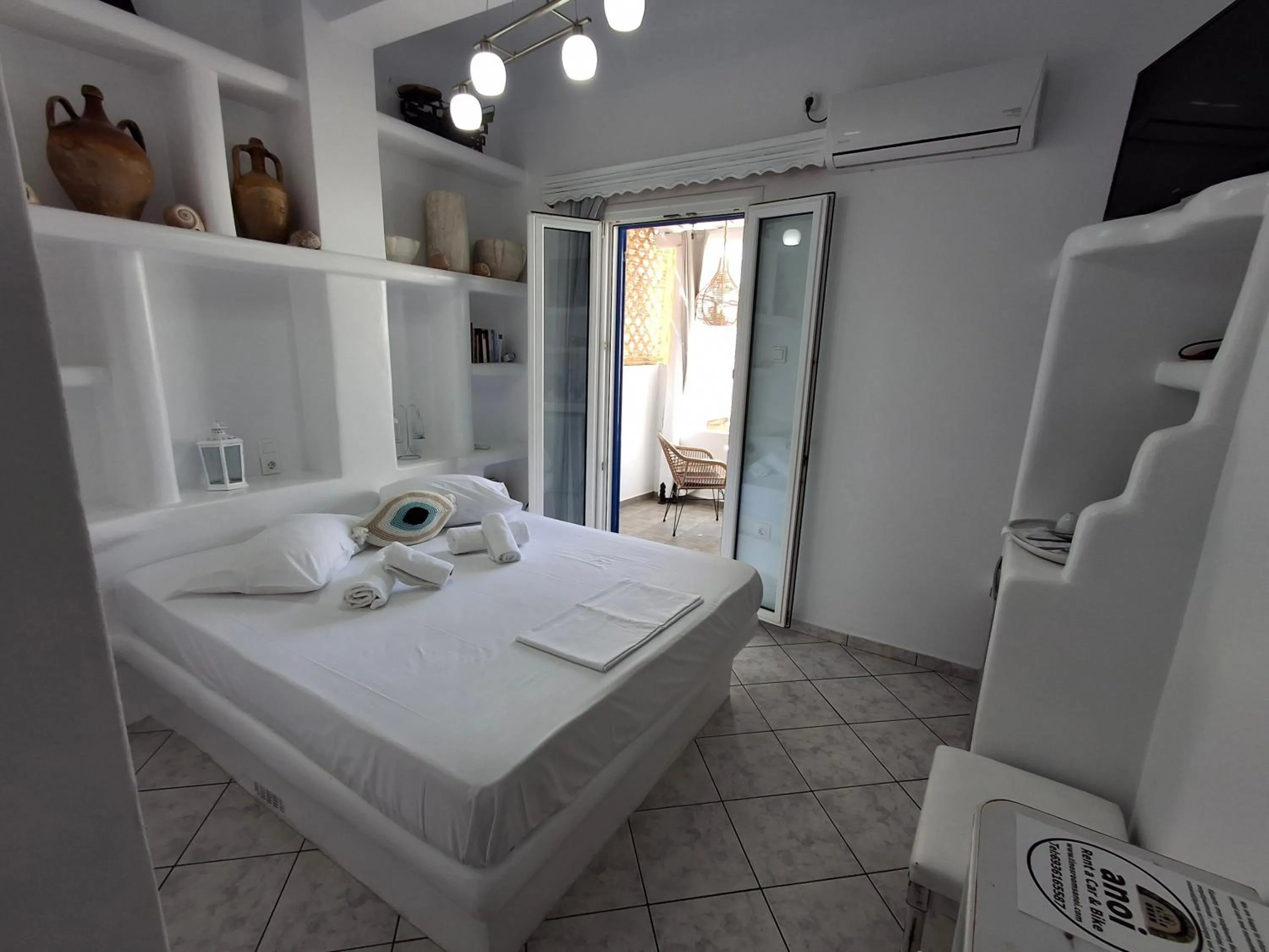 Bed in Anoi Rooms