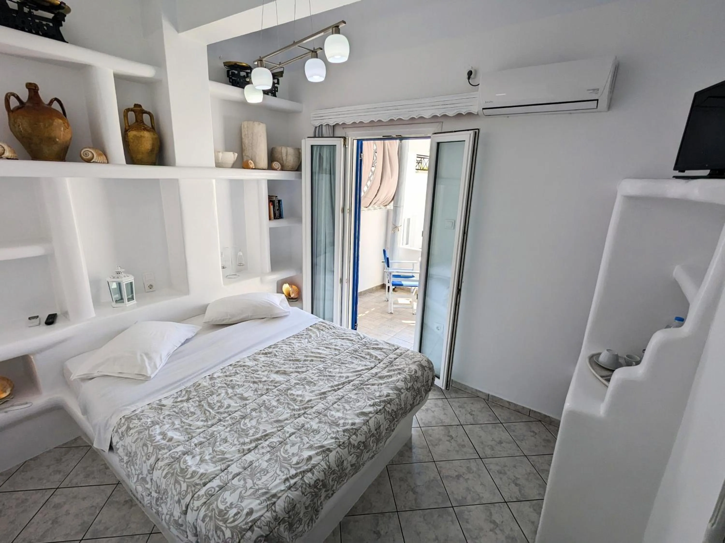 Bed in Anoi Rooms