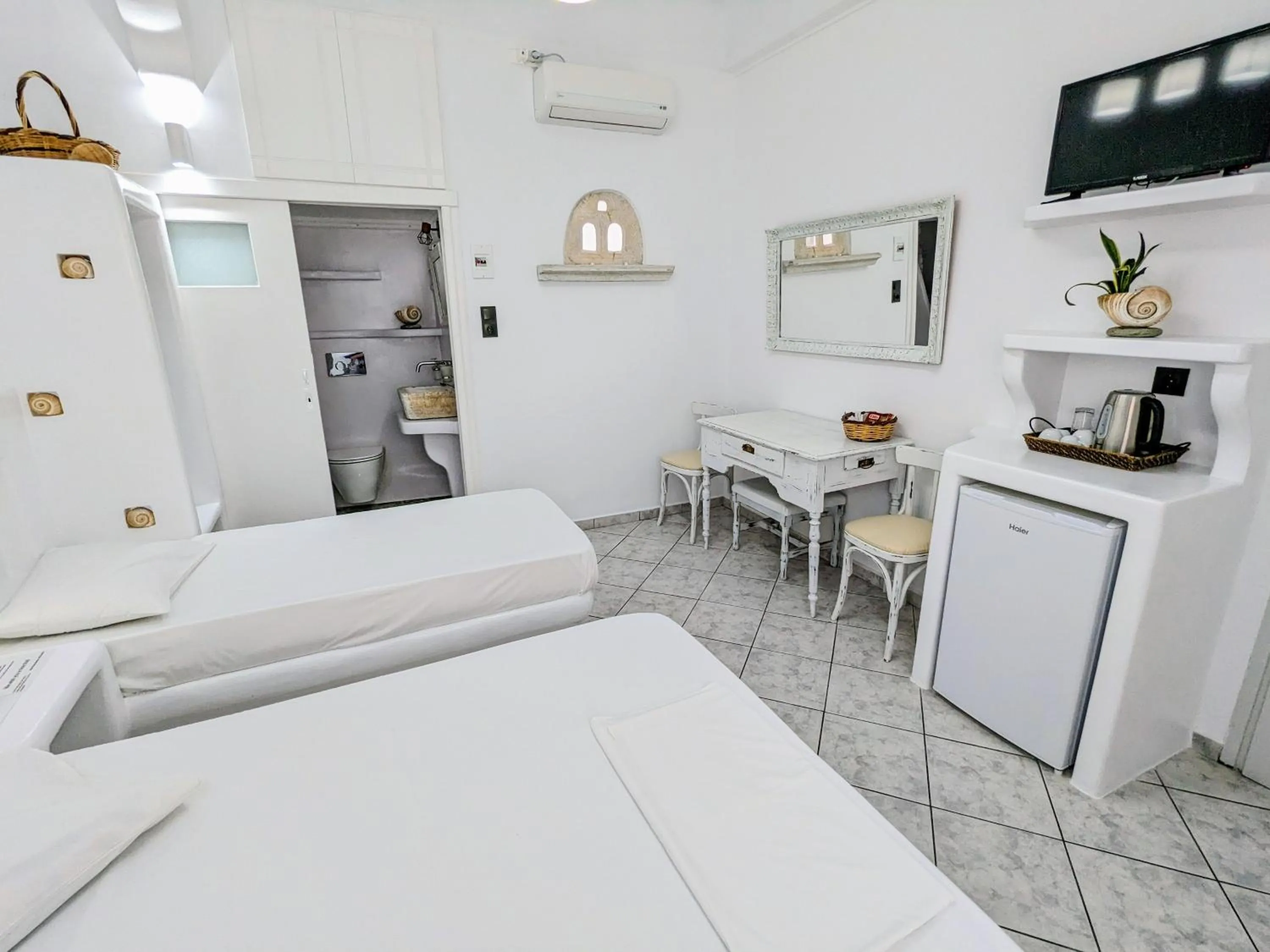 Bed in Anoi Rooms
