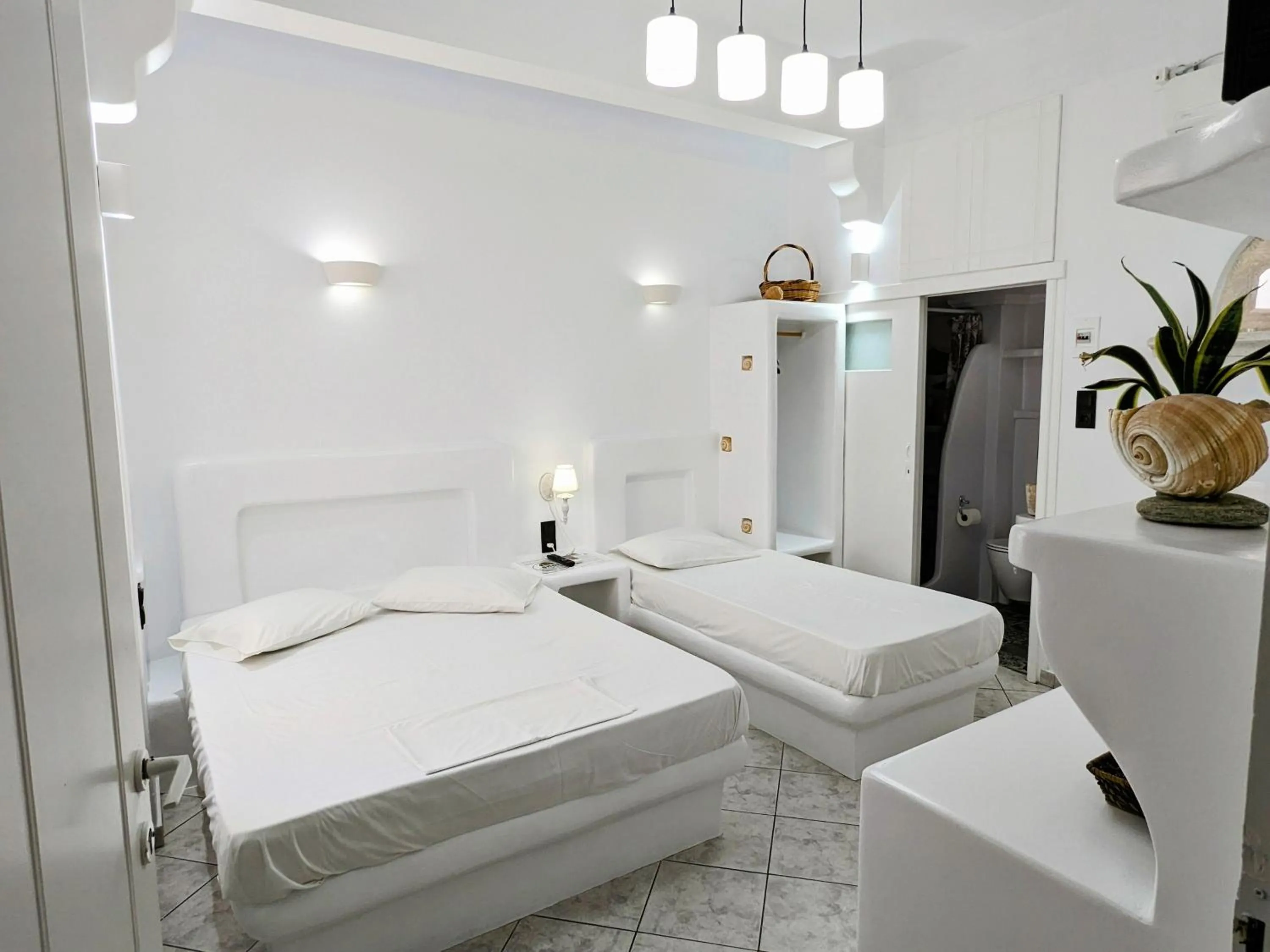 Bed in Anoi Rooms
