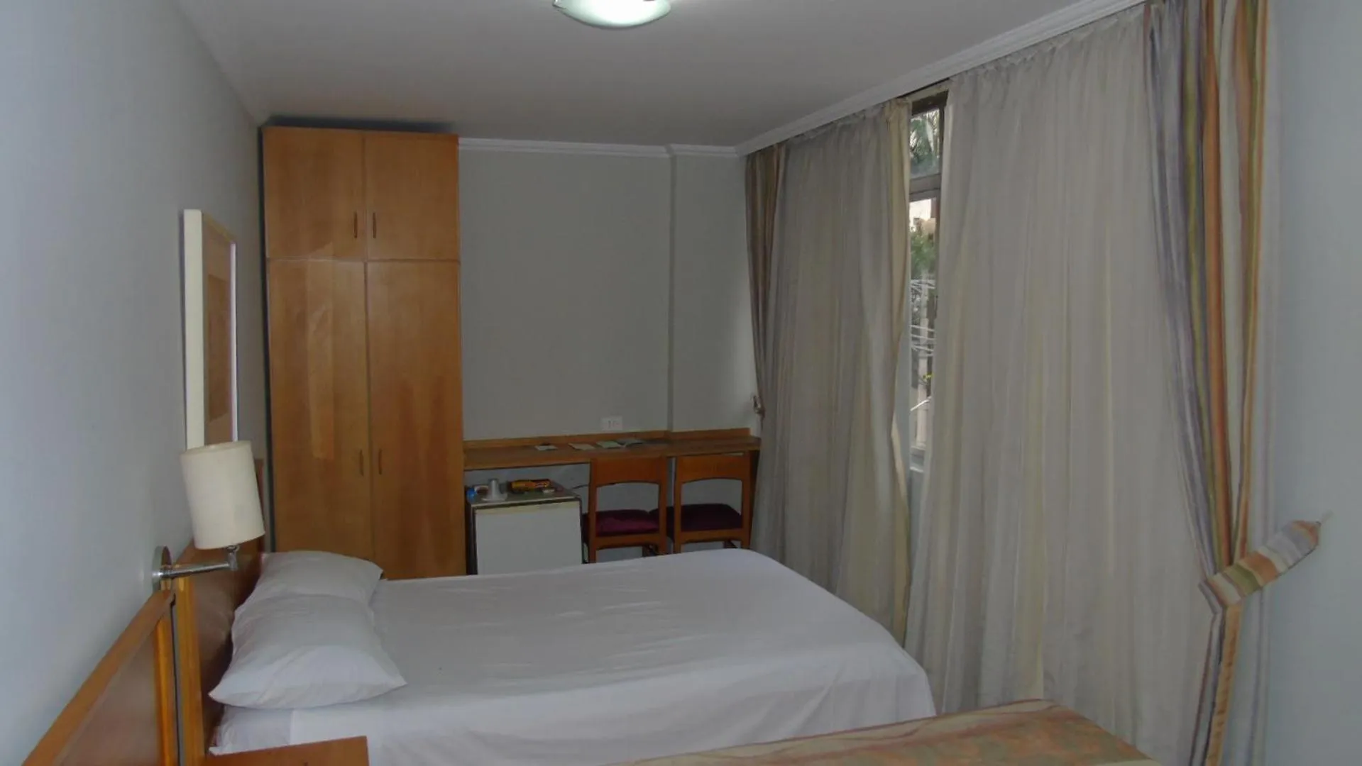 Bed in Paulista Garden Hotel