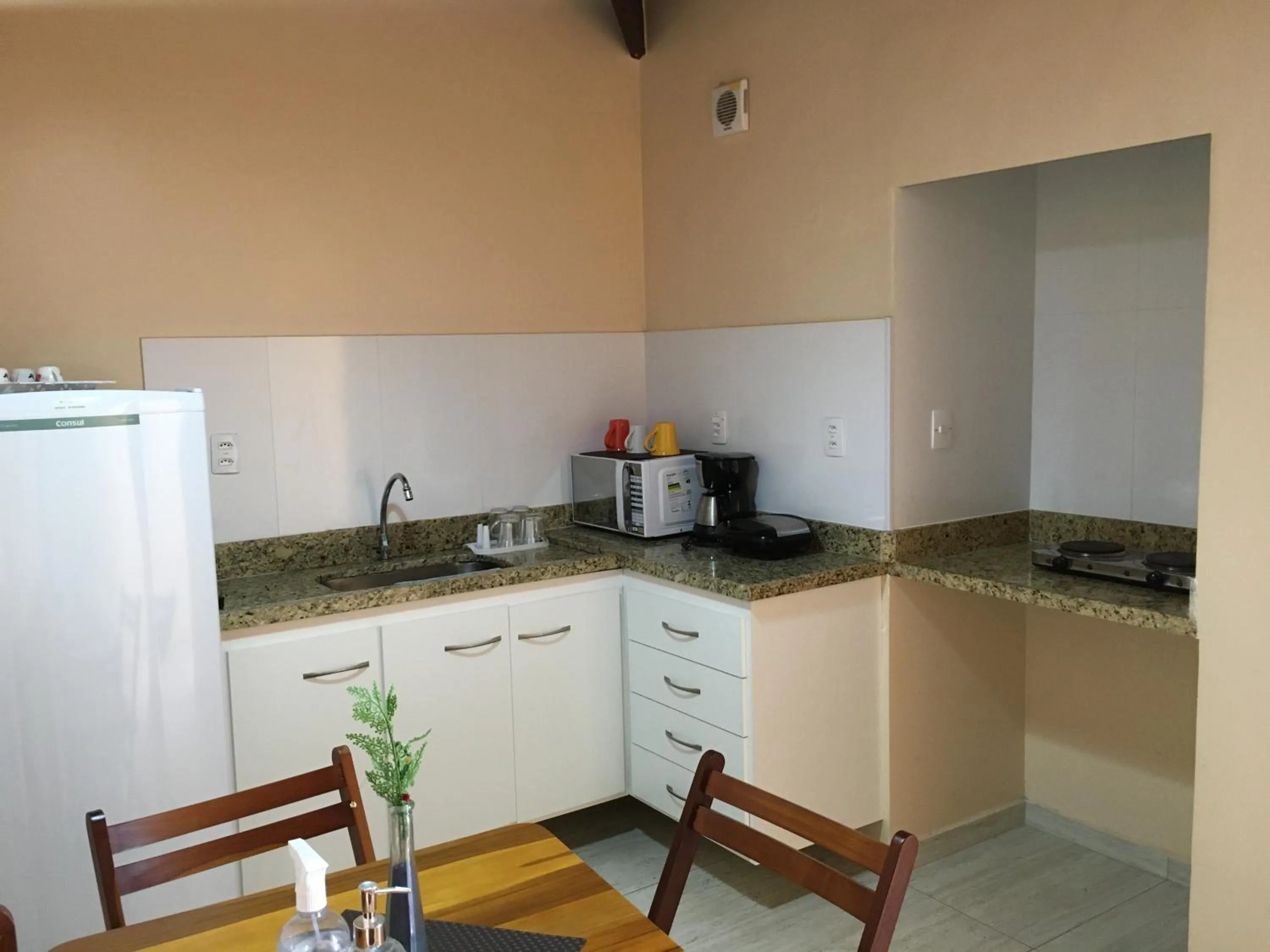 Kitchen or kitchenette in Apartamento no Centro Búzios