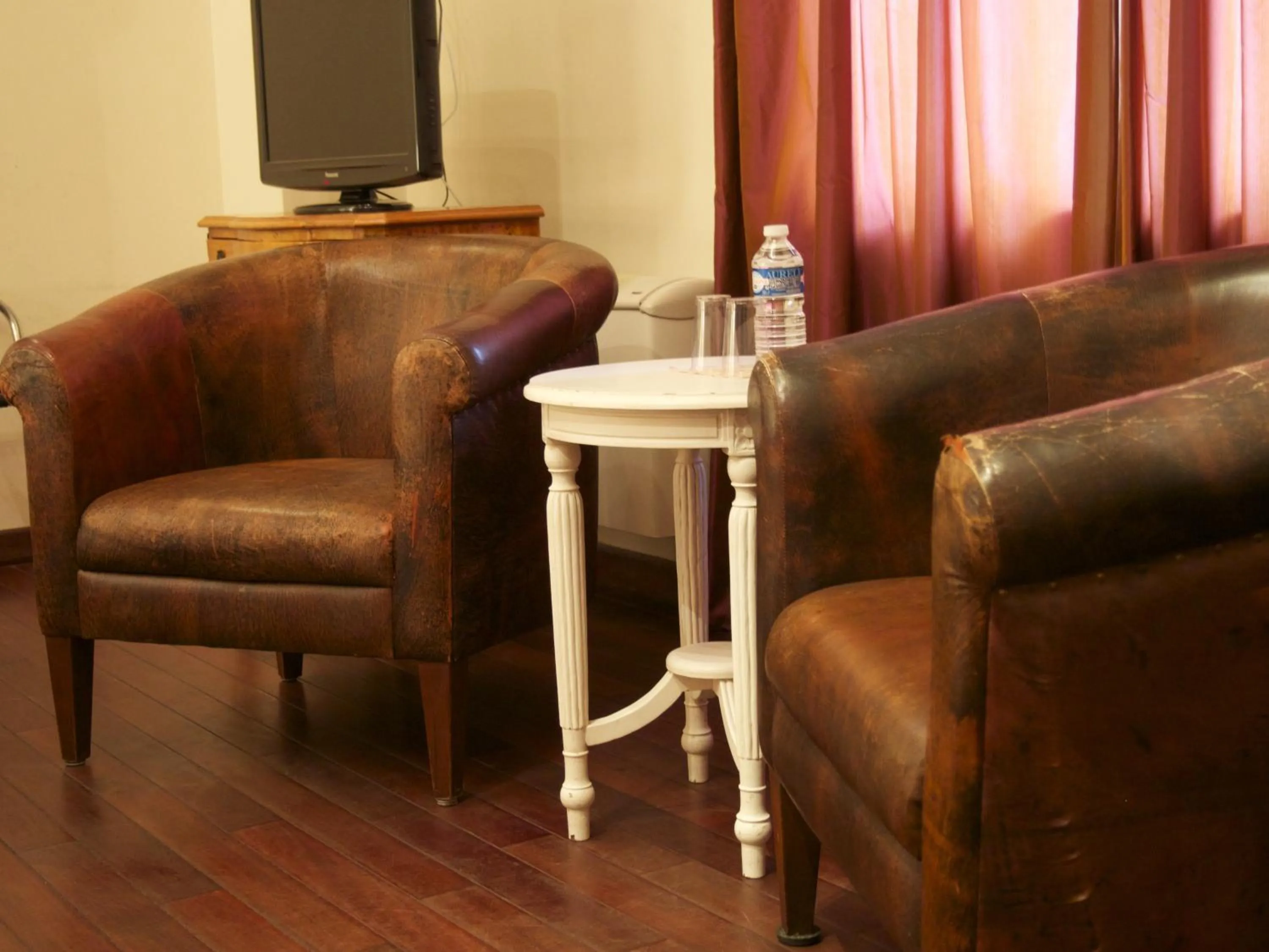 Seating area in Logis Hôtel Les Pages
