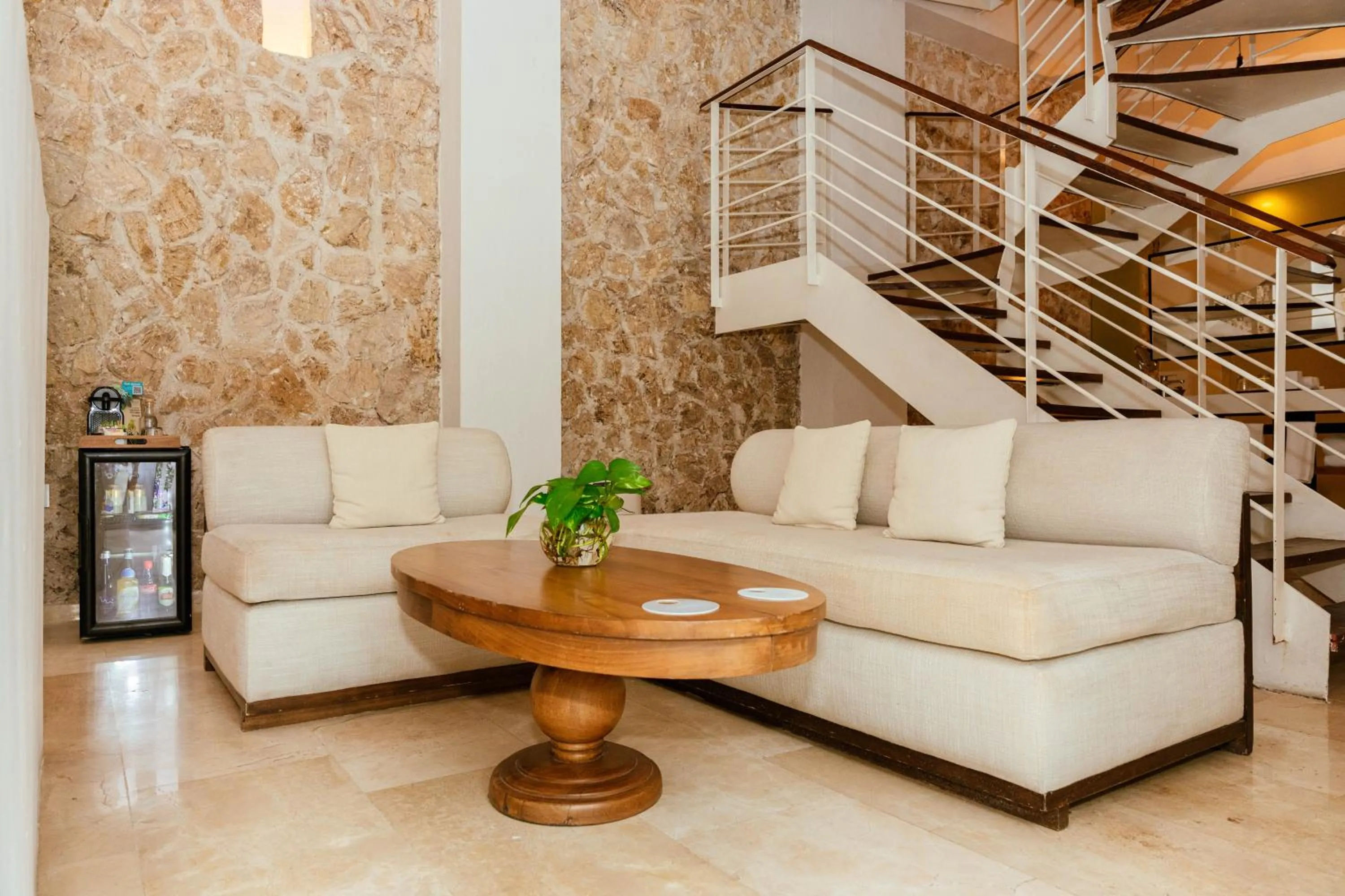 Living room in Nacar Hotel Cartagena, Curio Collection by Hilton