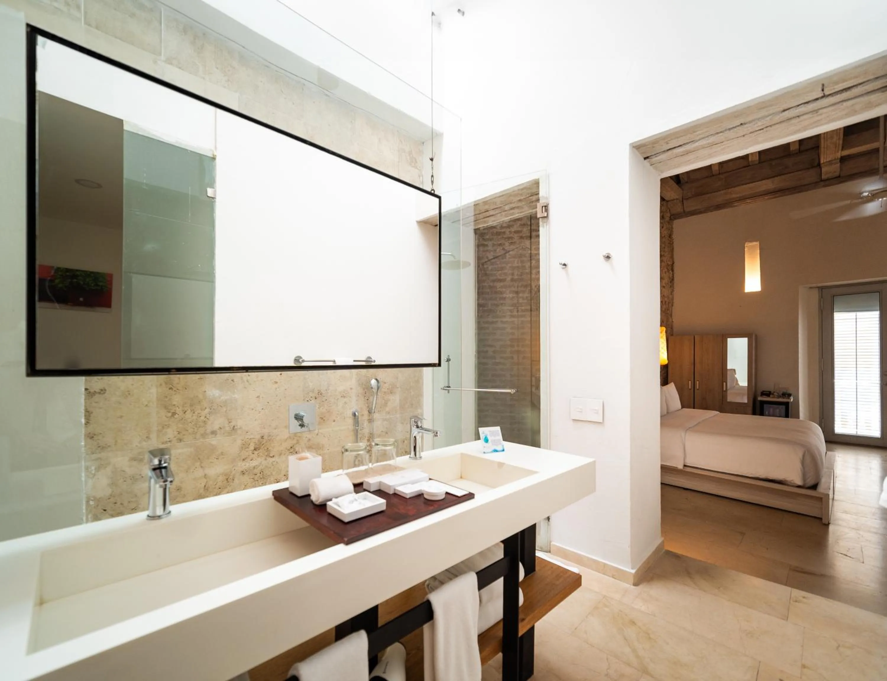 Bathroom, Bed in Nacar Hotel Cartagena, Curio Collection by Hilton