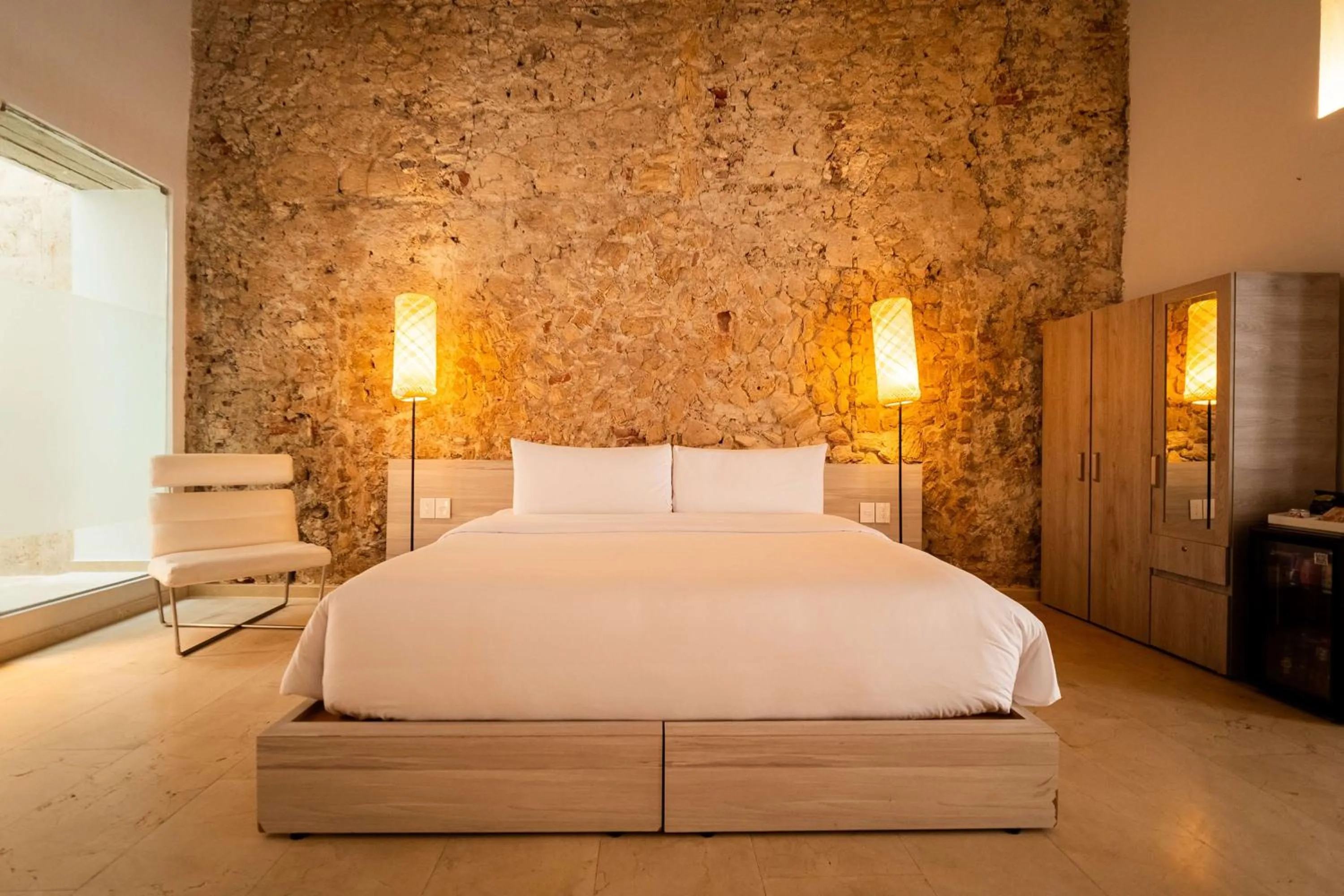 Bed in Nacar Hotel Cartagena, Curio Collection by Hilton