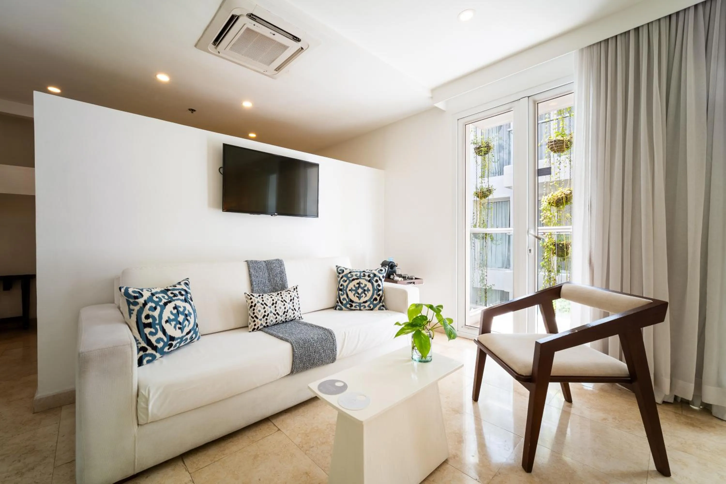Living room in Nacar Hotel Cartagena, Curio Collection by Hilton