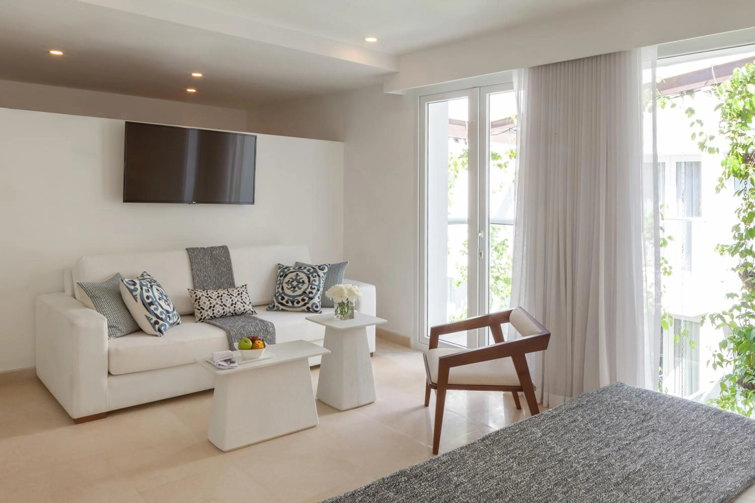 Living room in Nacar Hotel Cartagena, Curio Collection by Hilton