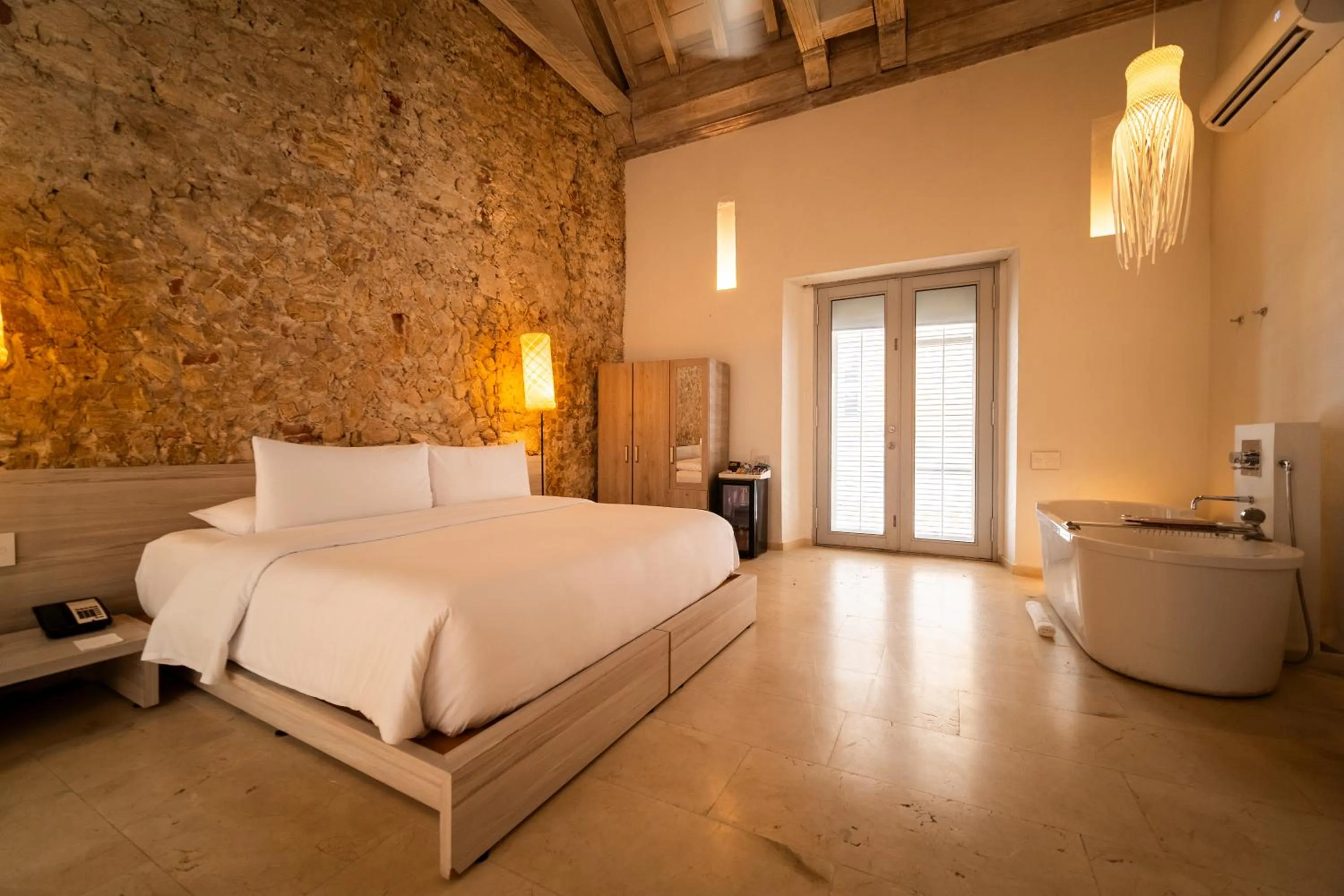 Bedroom, Bed in Nacar Hotel Cartagena, Curio Collection by Hilton