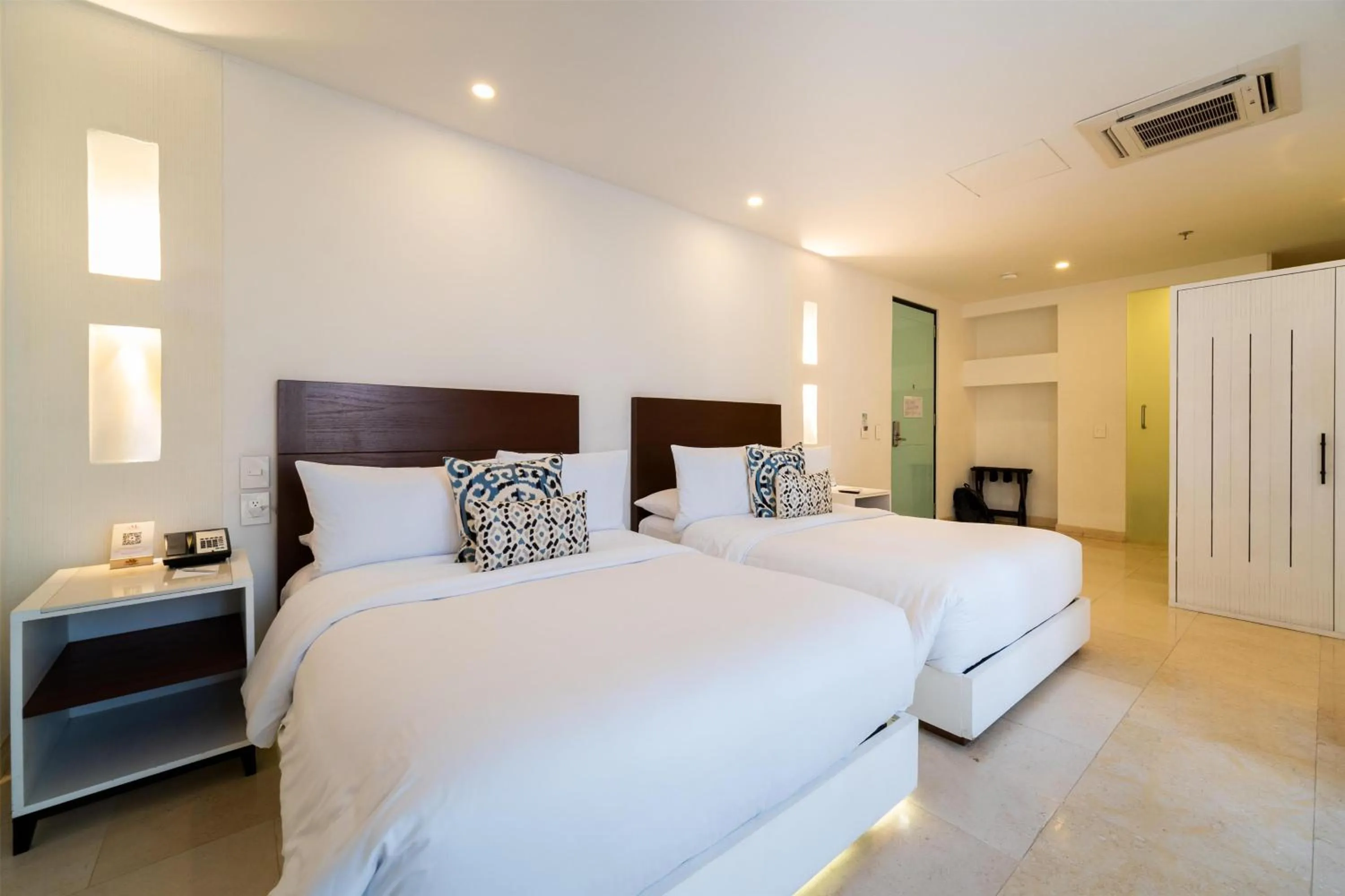 Bed in Nacar Hotel Cartagena, Curio Collection by Hilton