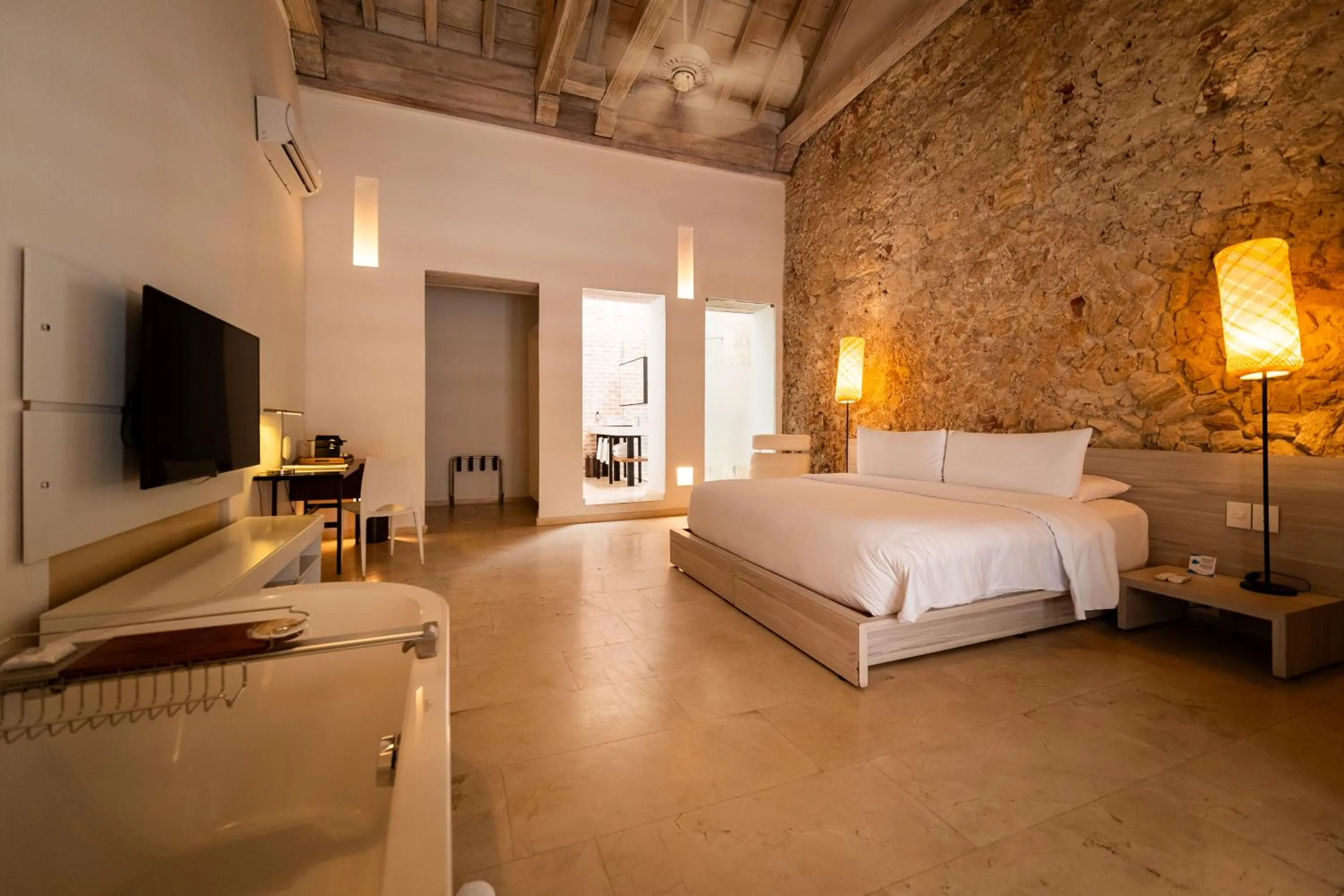 Bedroom, Bed in Nacar Hotel Cartagena, Curio Collection by Hilton