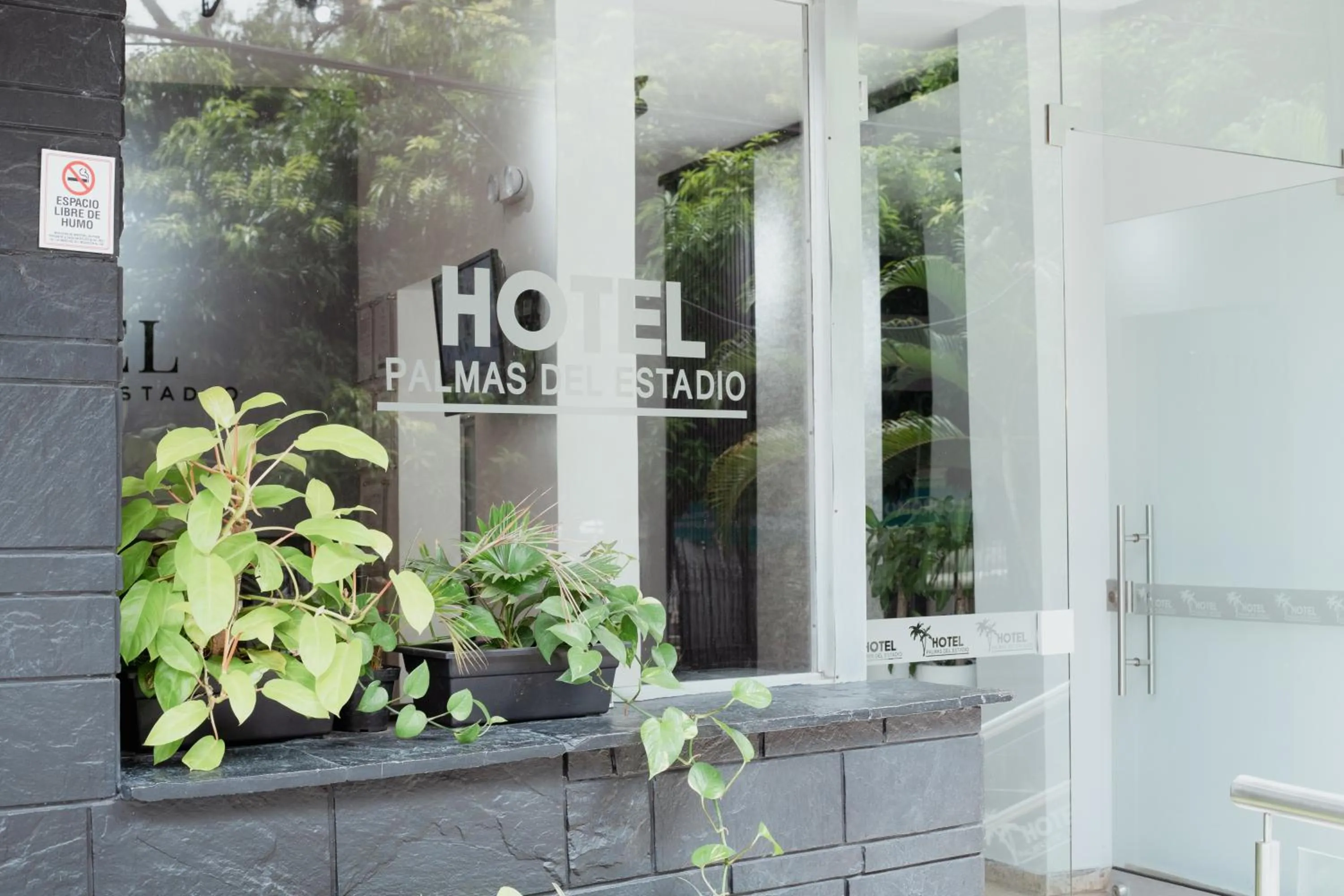 Property logo or sign in Hotel Palmas del Estadio