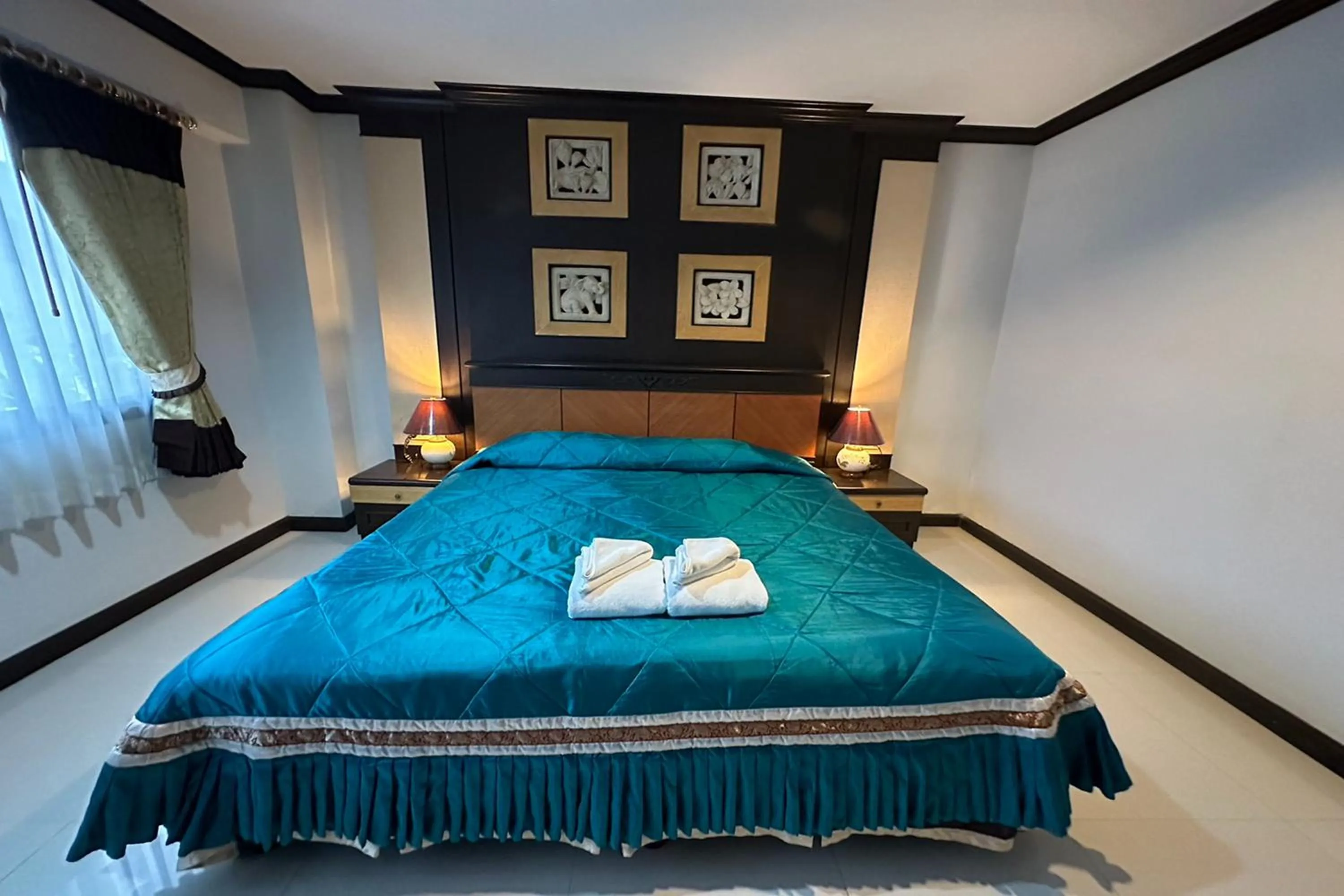 Bed in Chiangrai Grand Room Hotel