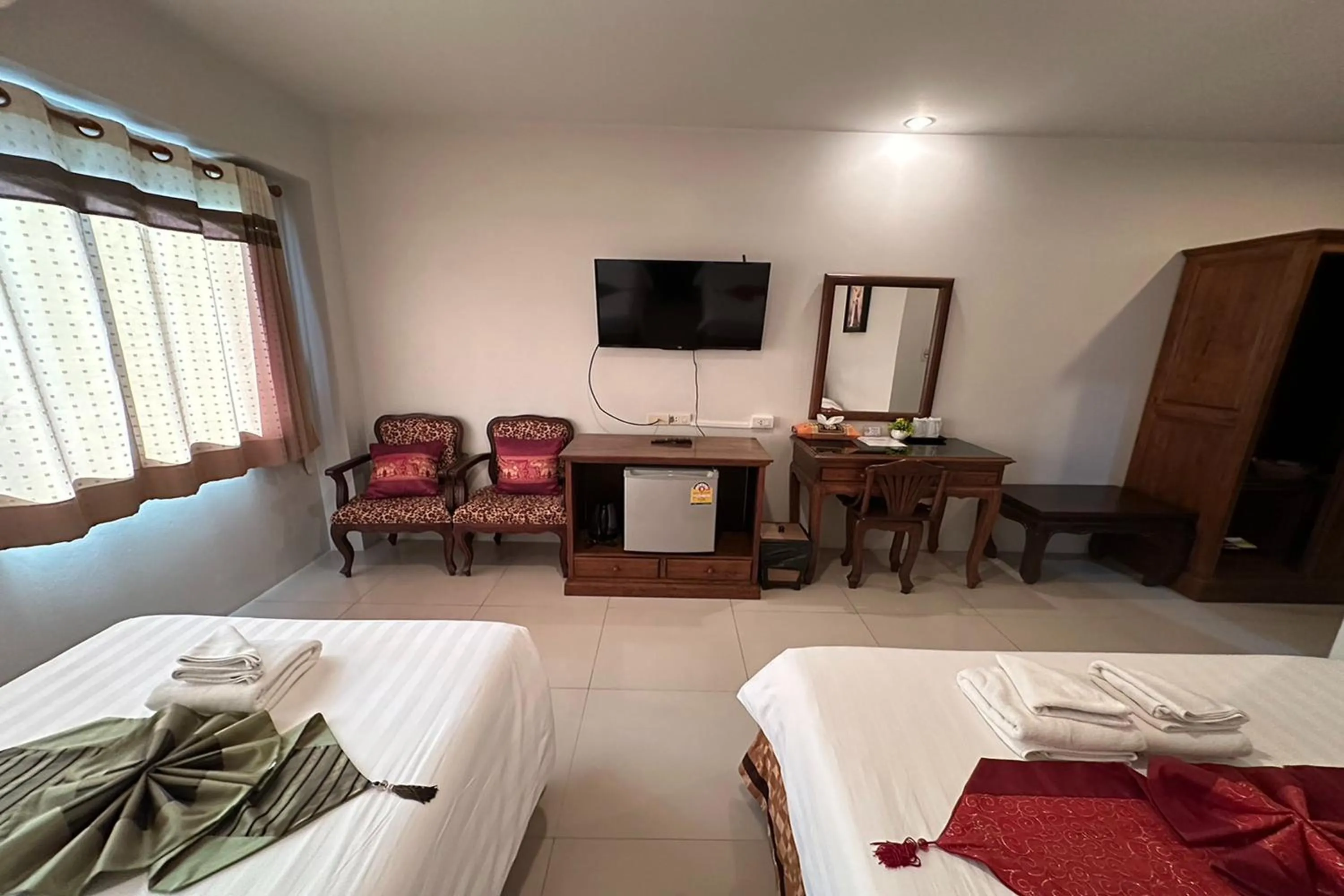 Bed in Chiangrai Grand Room Hotel