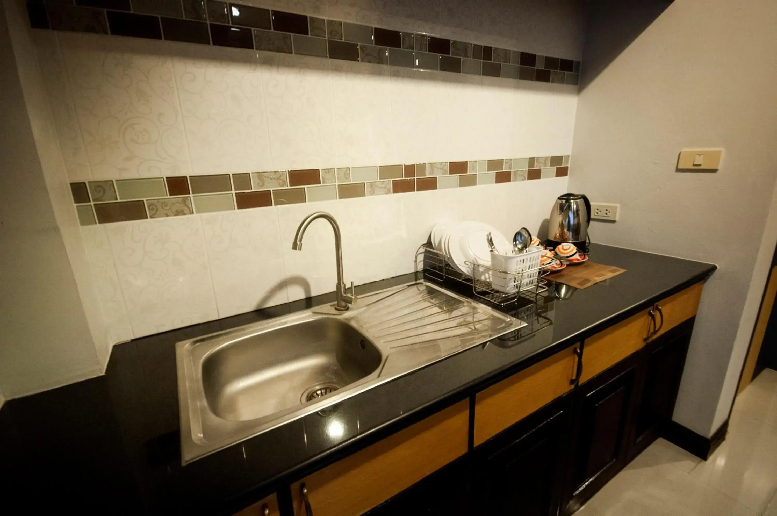 Kitchen or kitchenette in Chiangrai Grand Room Hotel Kitchen or kitchenette in Chiangrai Grand Room Hotel